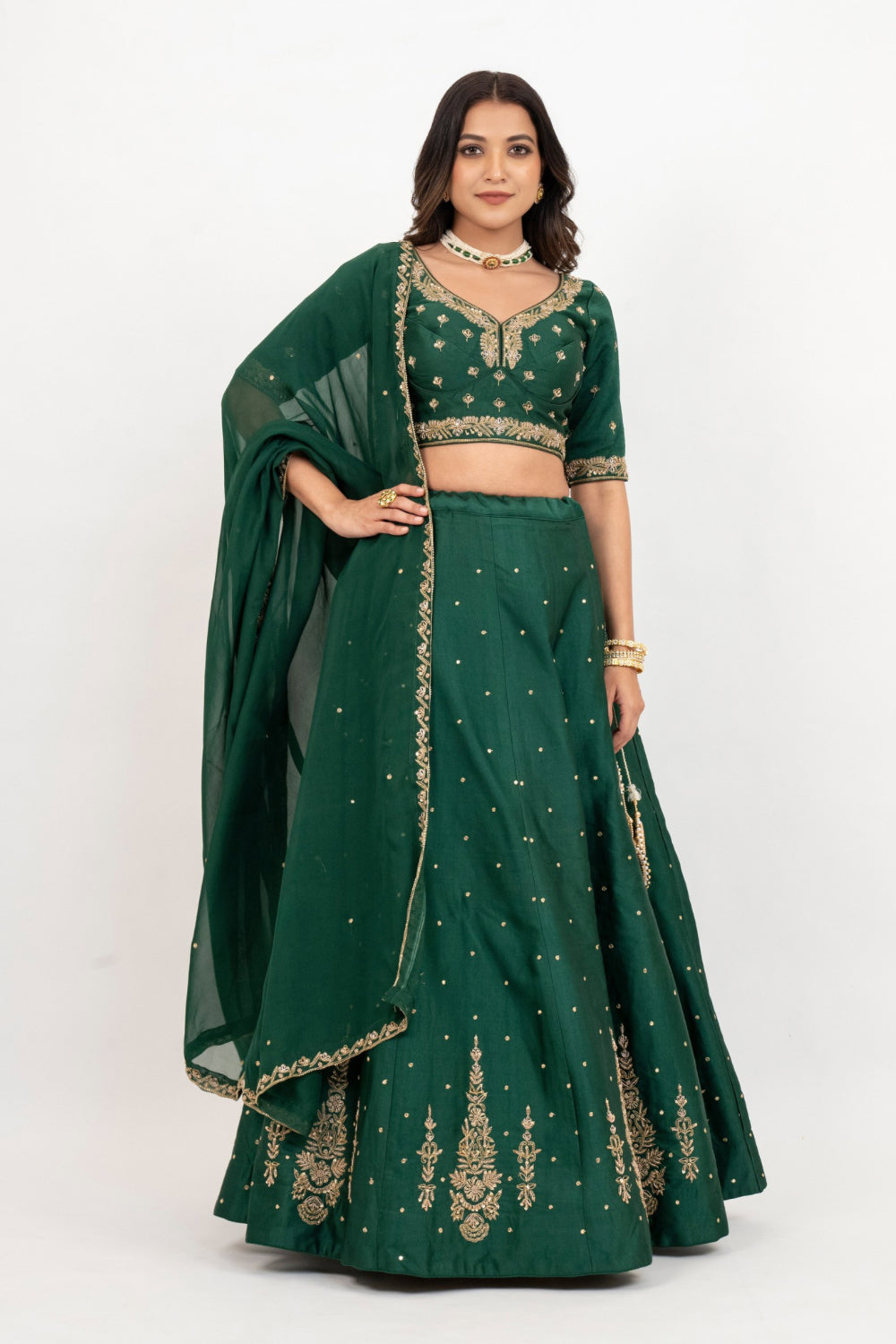 Bottle green soft silk zardozi embroidered lehenga choli with hand cut dana work