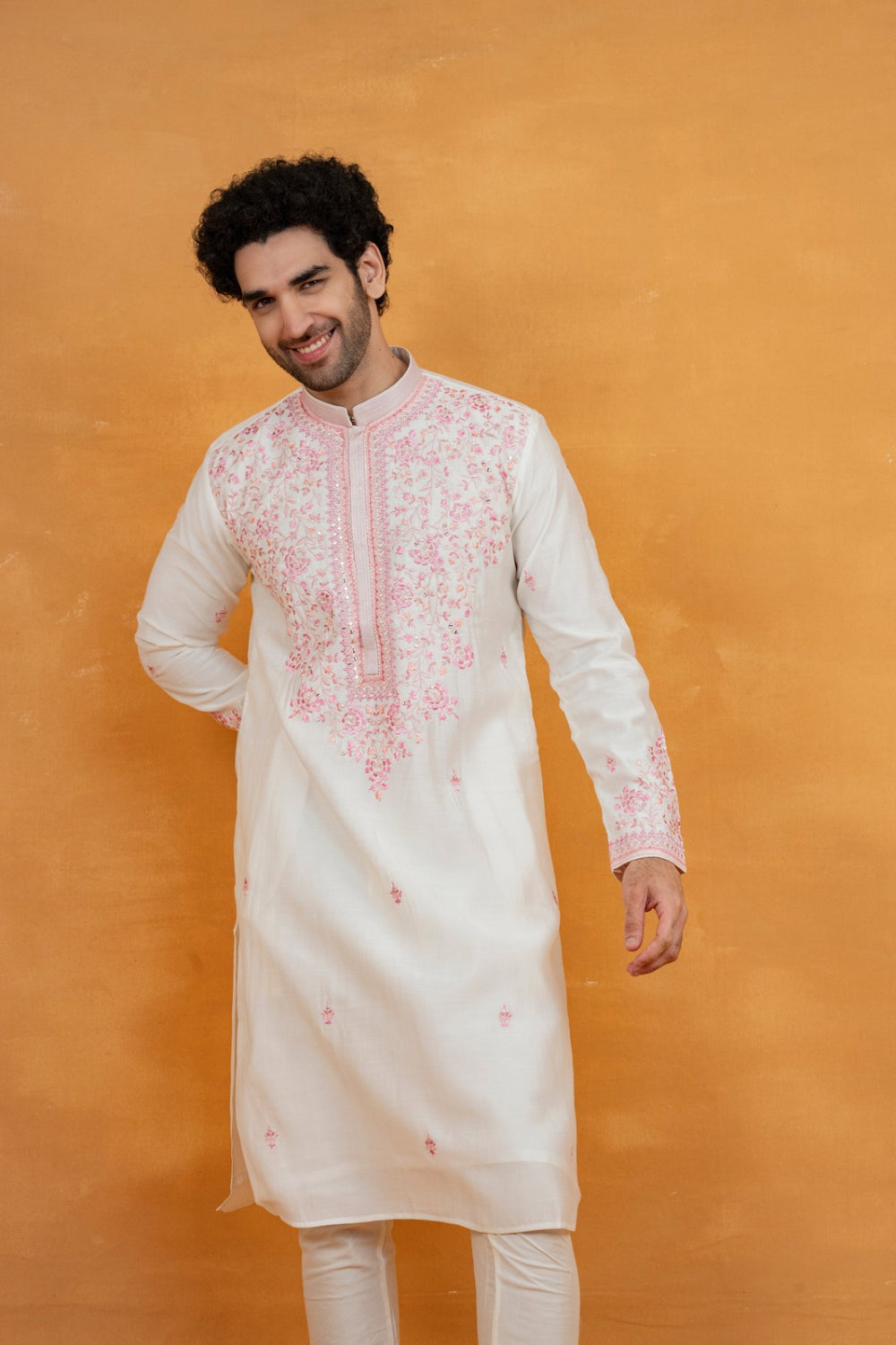 Cream silk kurta set with pink resham embroidery and mirror work