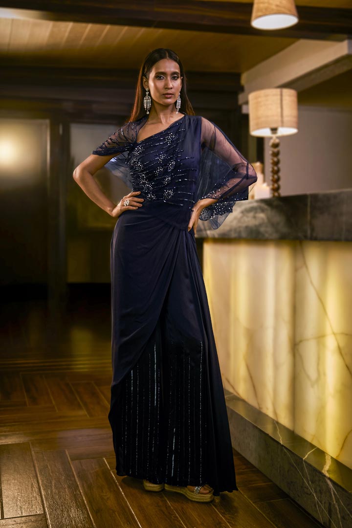 Midnight Blue jumpsuit with sheer sleeve and draped silhouette