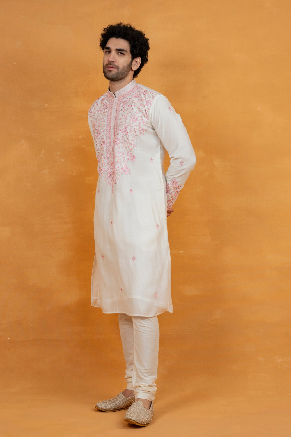 Cream silk kurta set with pink resham embroidery and mirror work