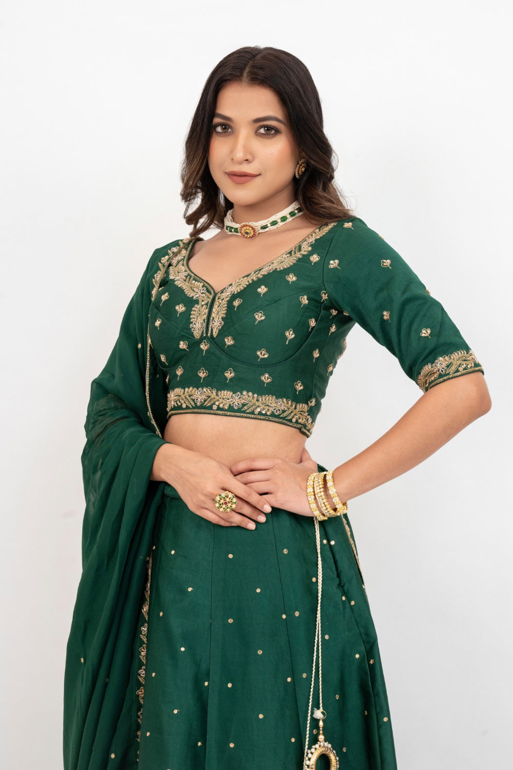 Bottle green soft silk zardozi embroidered lehenga choli with hand cut dana work