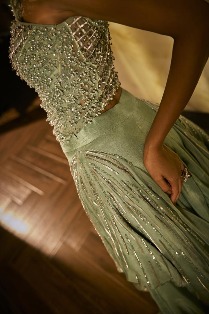 Mint green lehenga set with an embellished blouse
