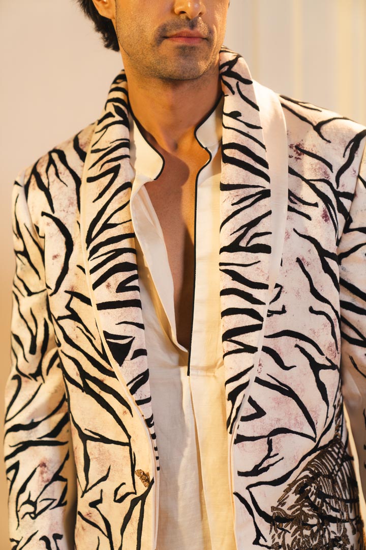 Concept blazer with hand paint and hand embroidery. paired with a matching kurta and trousers.