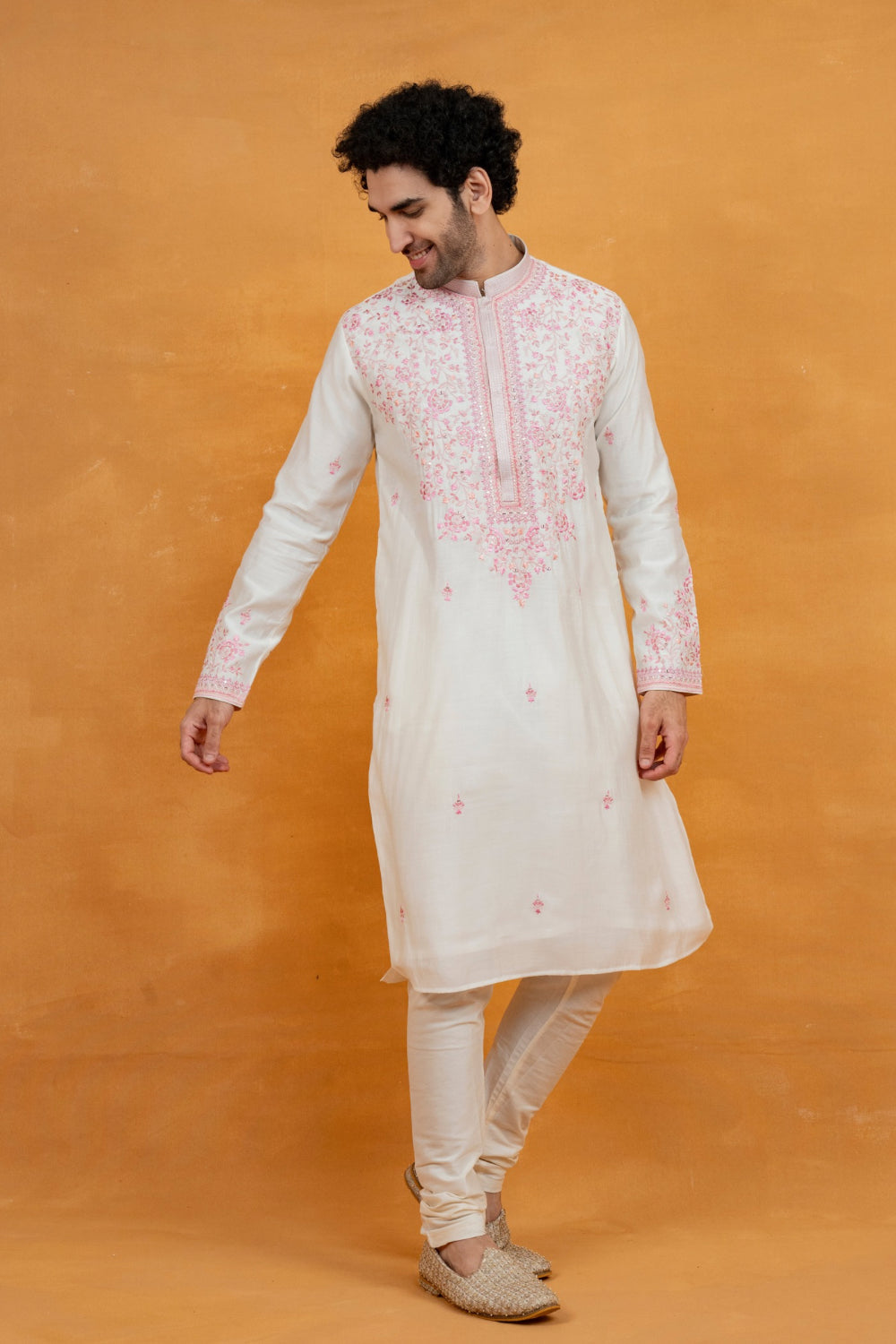 Cream silk kurta set with pink resham embroidery and mirror work