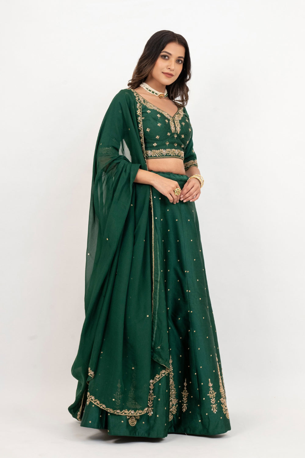 Bottle green soft silk zardozi embroidered lehenga choli with hand cut dana work