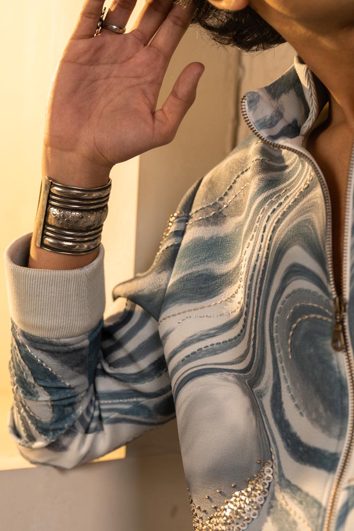 Printed wave bomber with denims