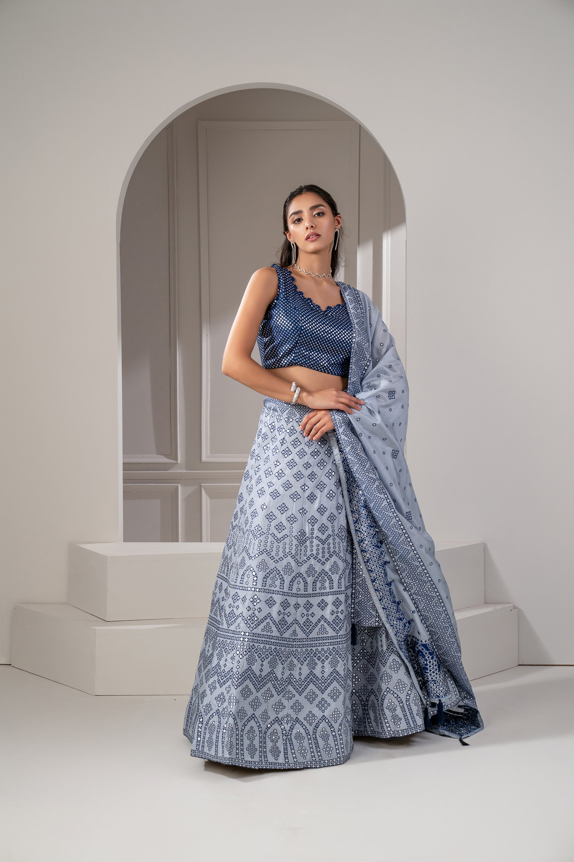 Silver Blue Soft Silk Lehenga Set With Mirror Embellishements.