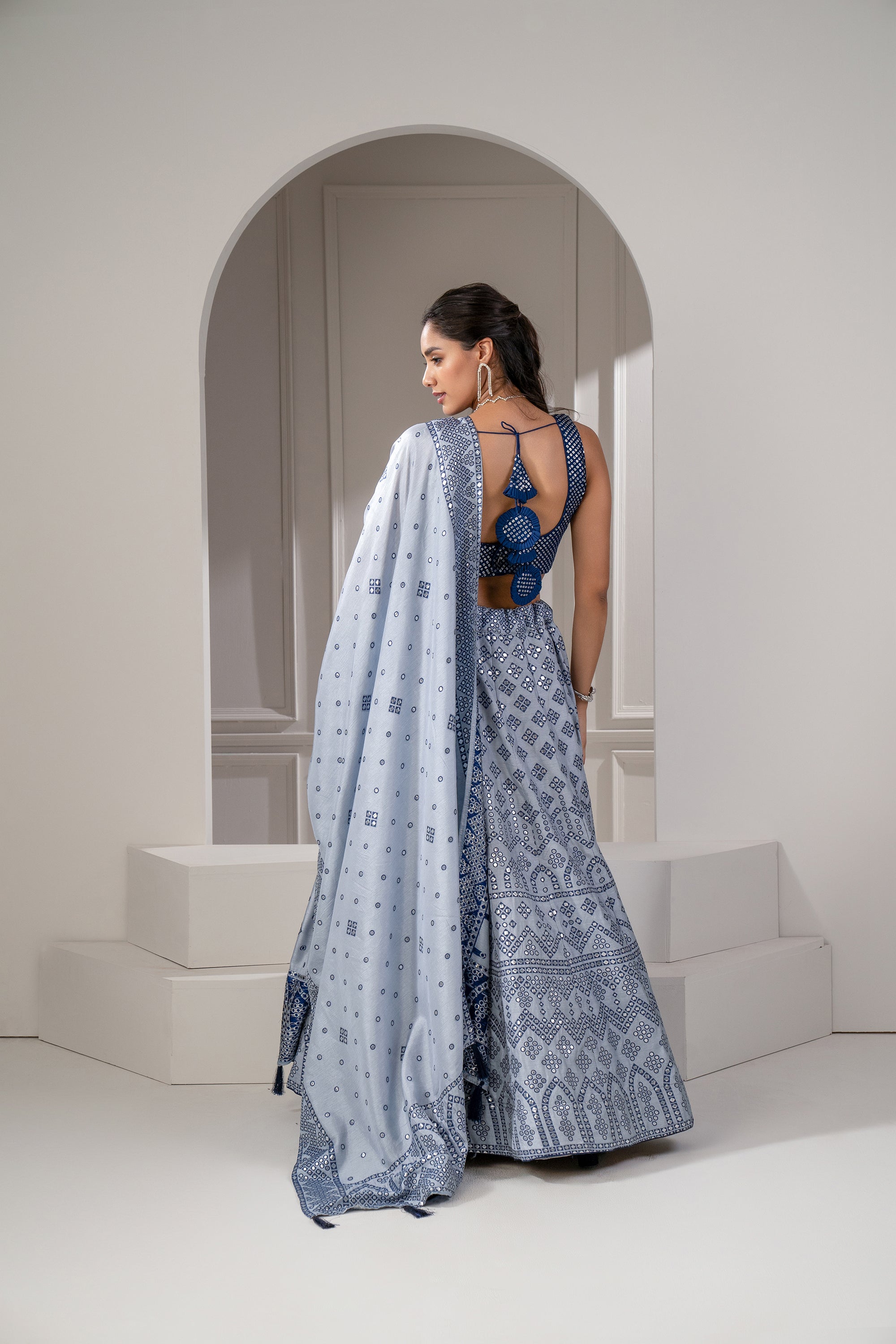 Silver Blue Soft Silk Lehenga Set With Mirror Embellishements.