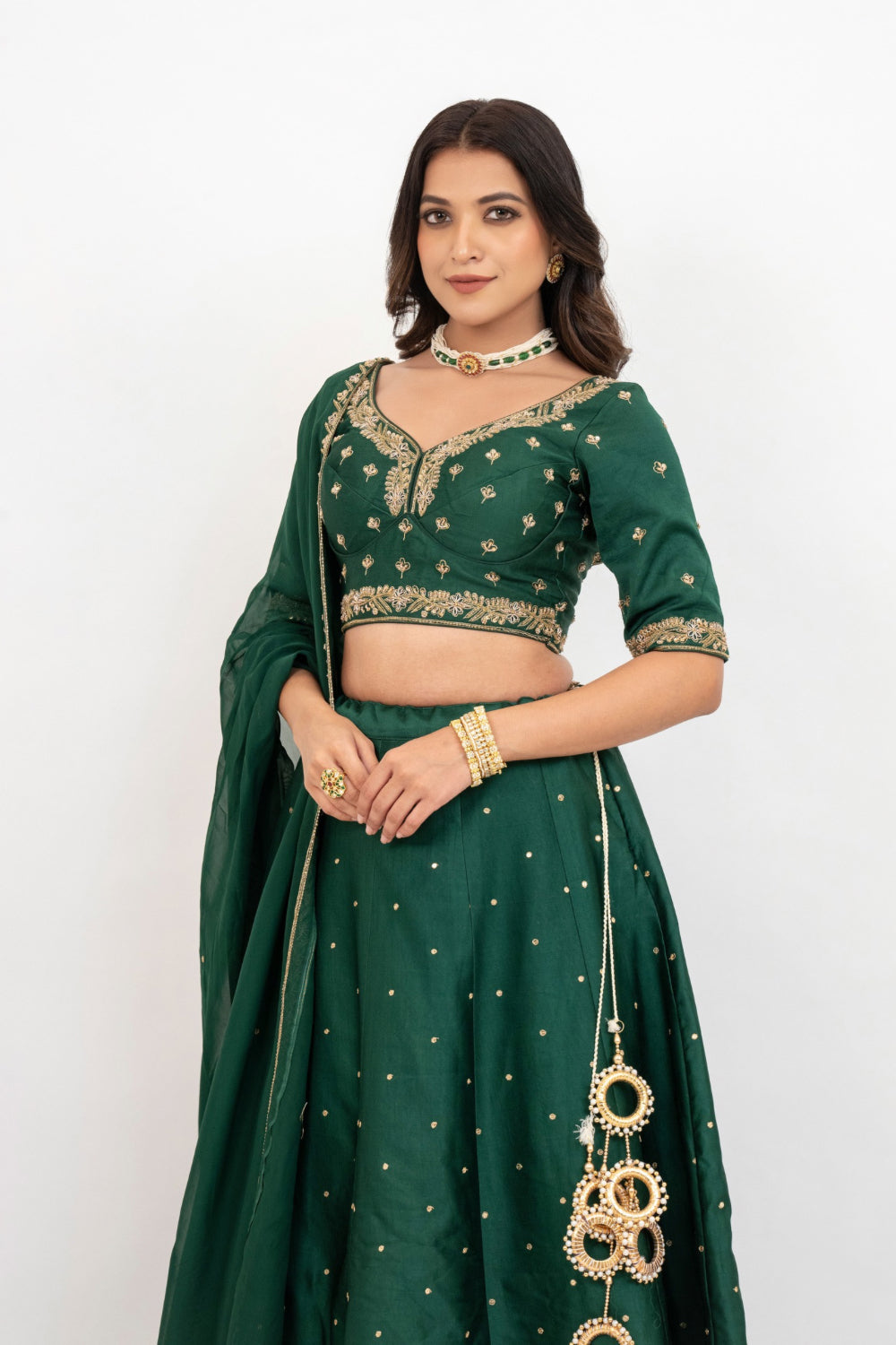 Bottle green soft silk zardozi embroidered lehenga choli with hand cut dana work