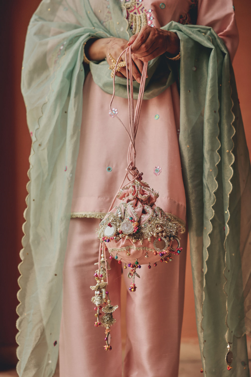 Handcrafted Peach Potli Bag with Metallic Embroidery & Fringe