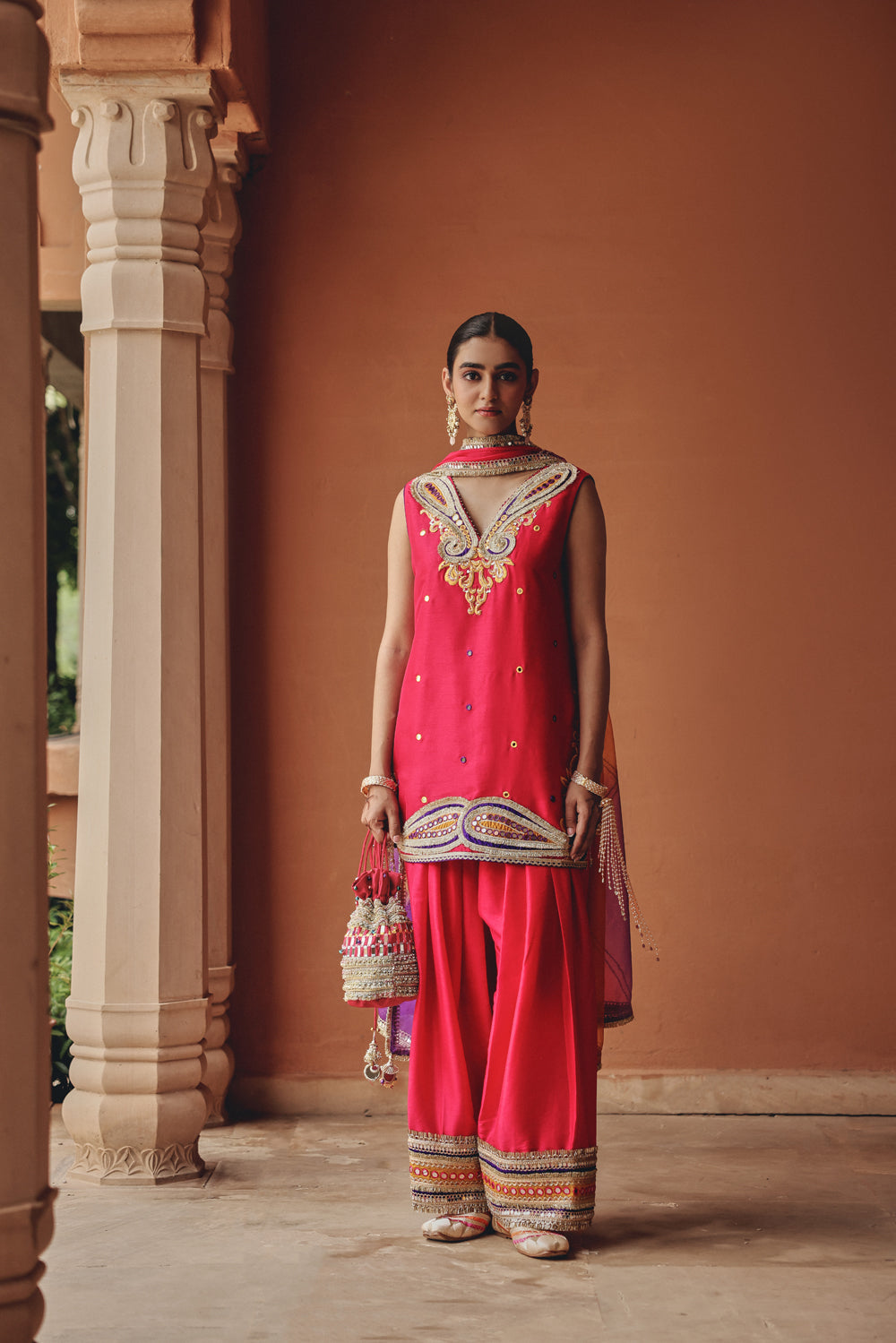 Rani Pink Embellished Potli Bag with Mirror Work and Tassels
