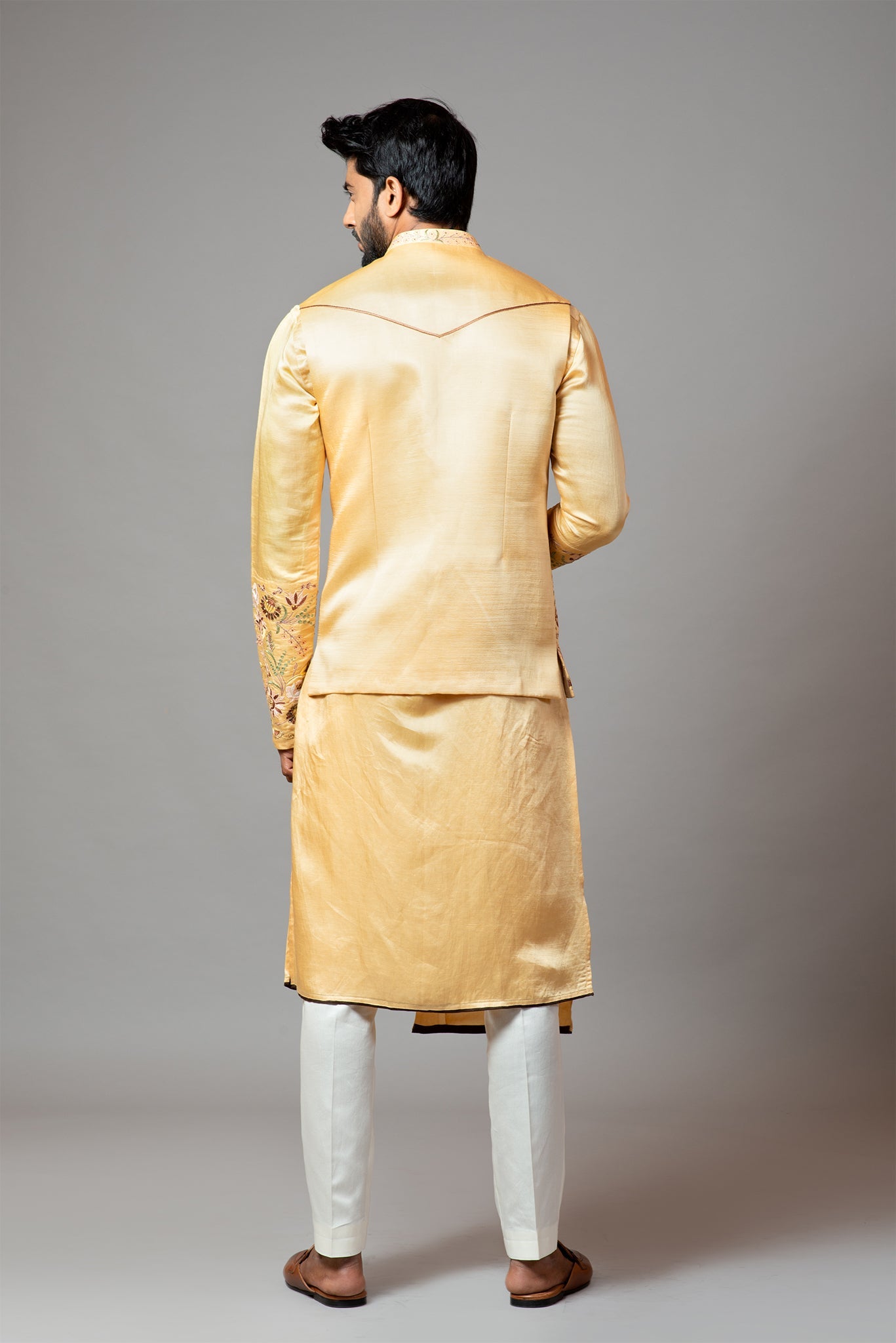 Mustard Nehru jacket Mustard Assymetric double panel kurta with embroidered sleeve and pant pajama set