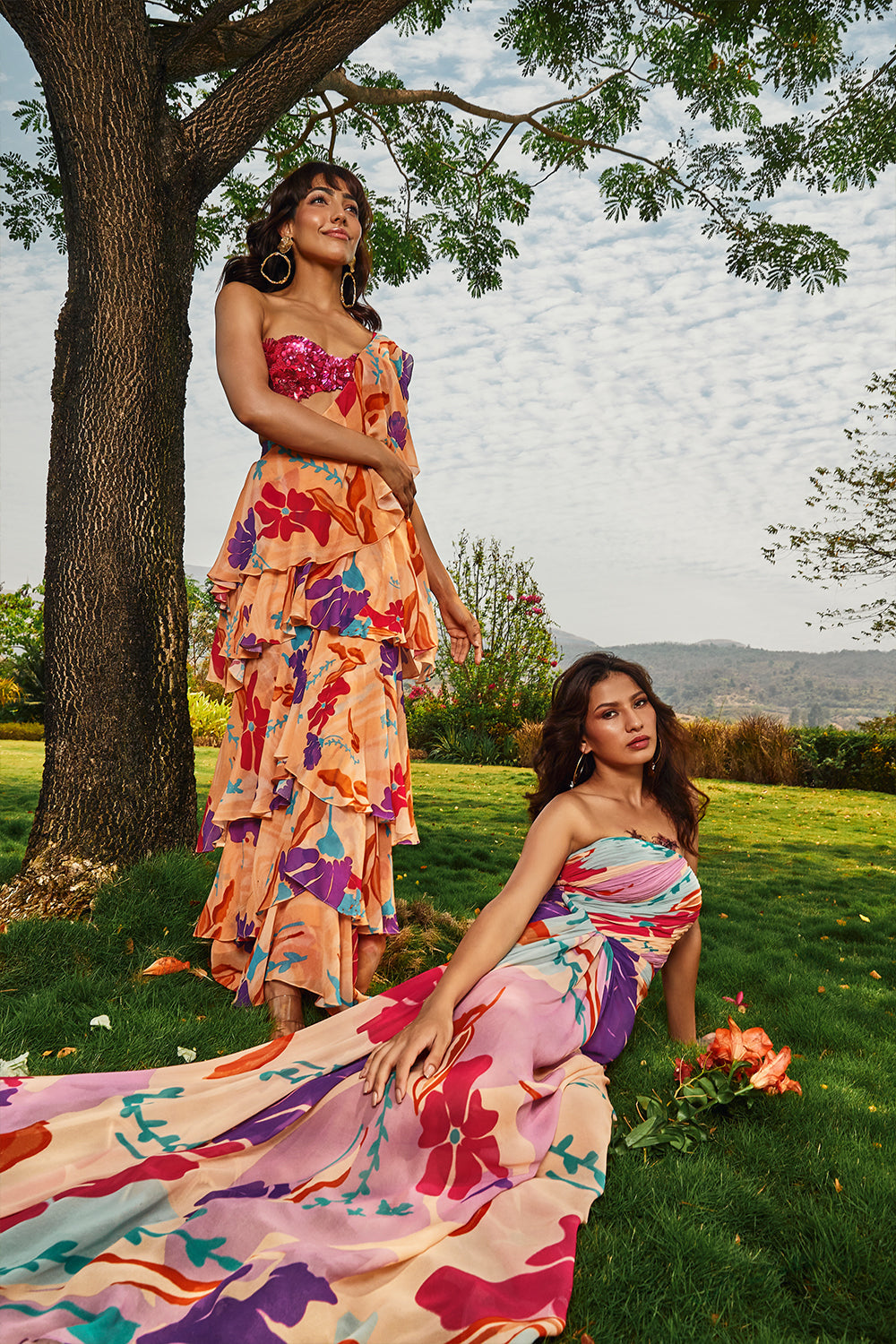 Cerise pink embellished bralette paired with floral printed ruffle saree.