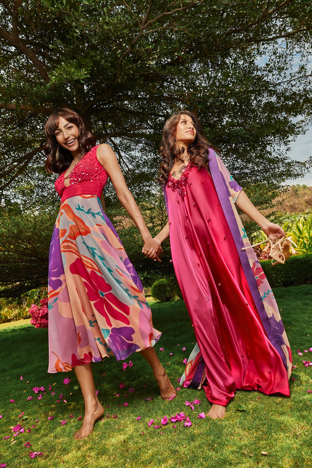 Foral printed cape paired with cerise pink bias dress.