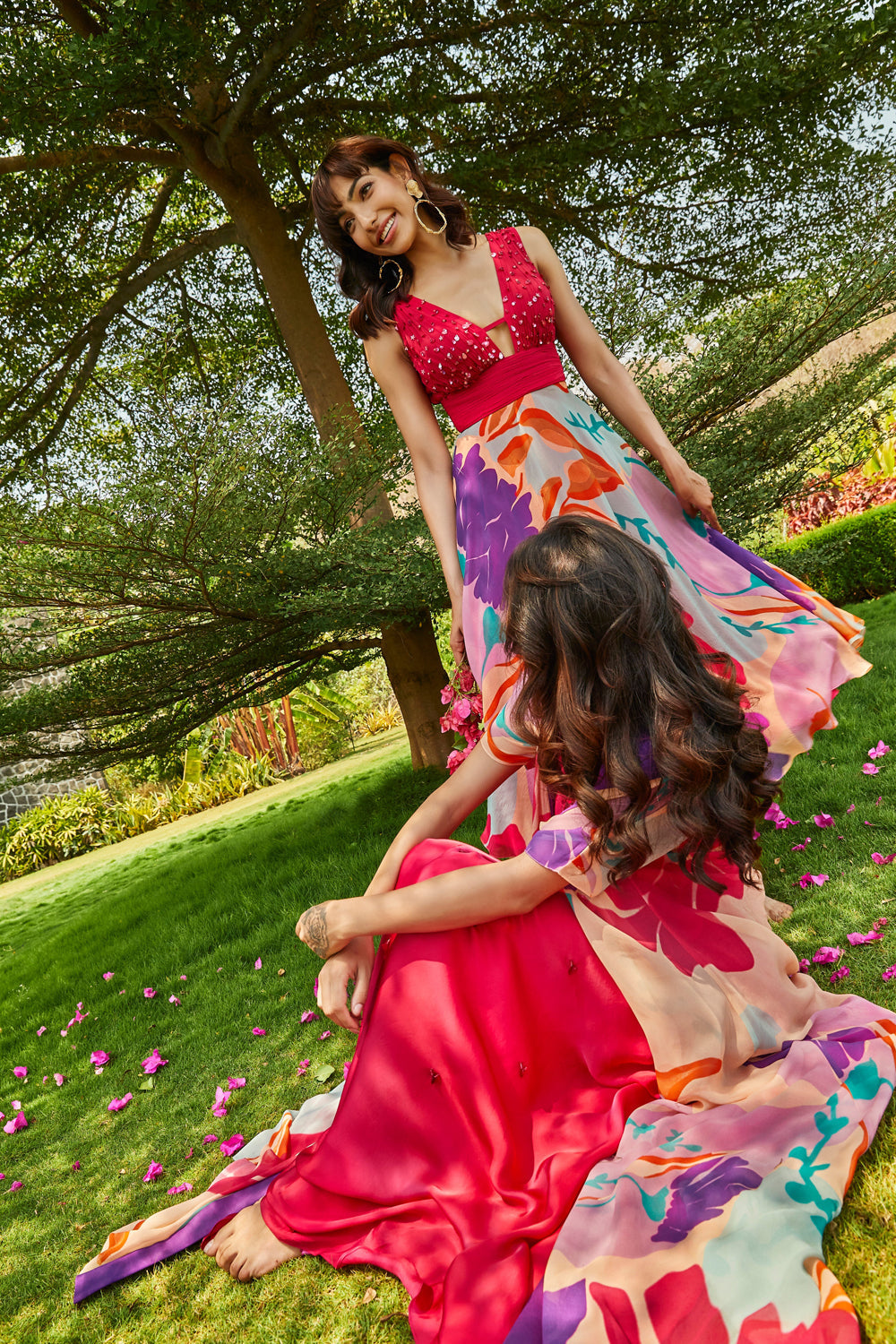 Foral printed cape paired with cerise pink bias dress.