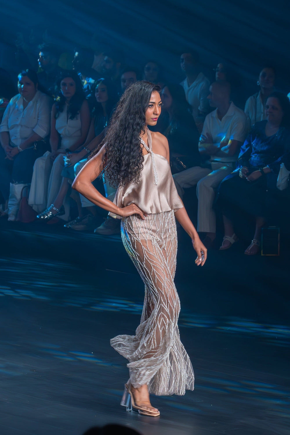 Taupe halter top with intricately embroidered flared pants.