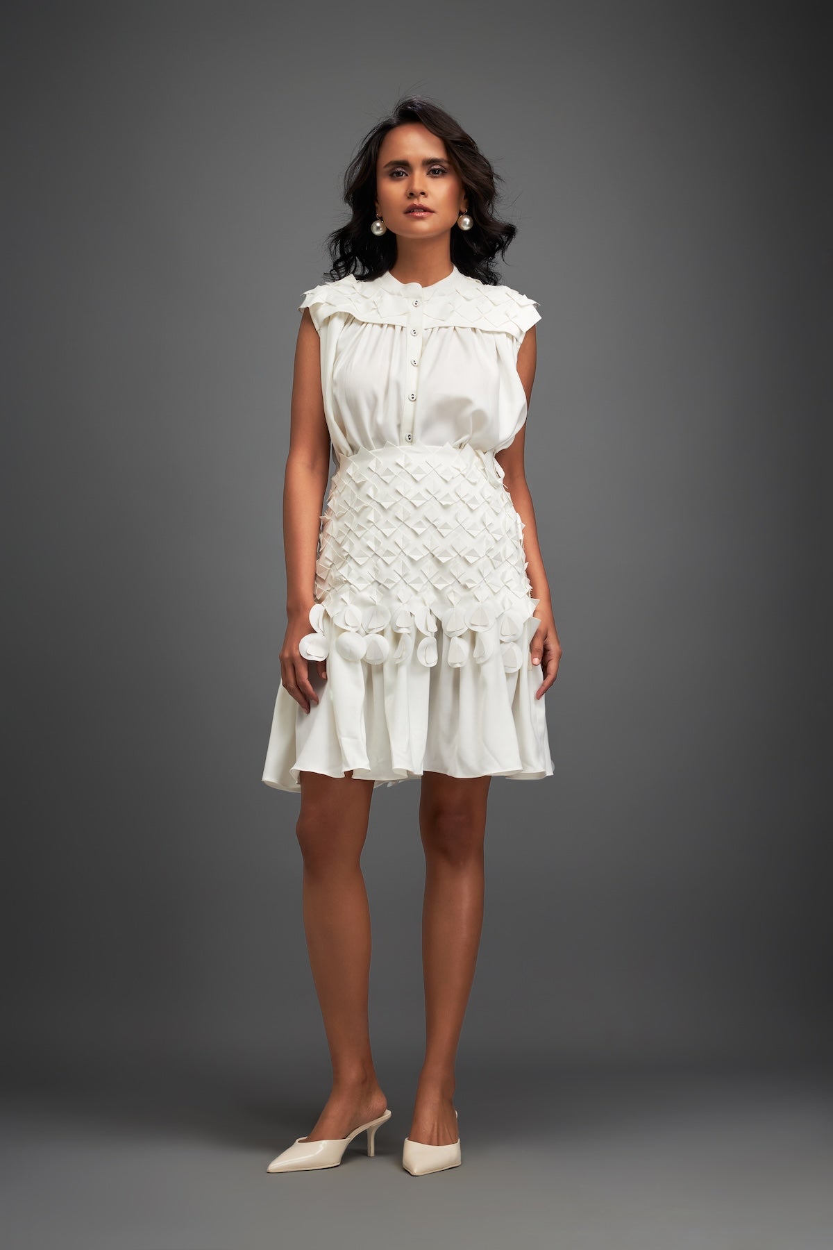 White Sleeveless Buttoned Top & Appliqué Skirt