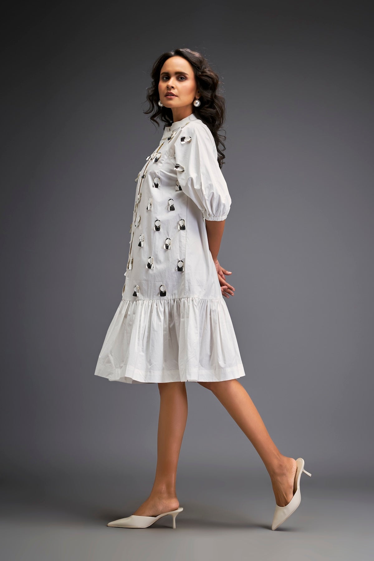Dress With Puff Sleeves And Glossy Metallic Discs And A Ruffled Hemline