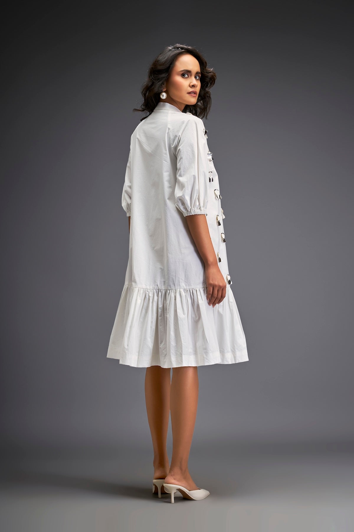 Dress With Puff Sleeves And Glossy Metallic Discs And A Ruffled Hemline