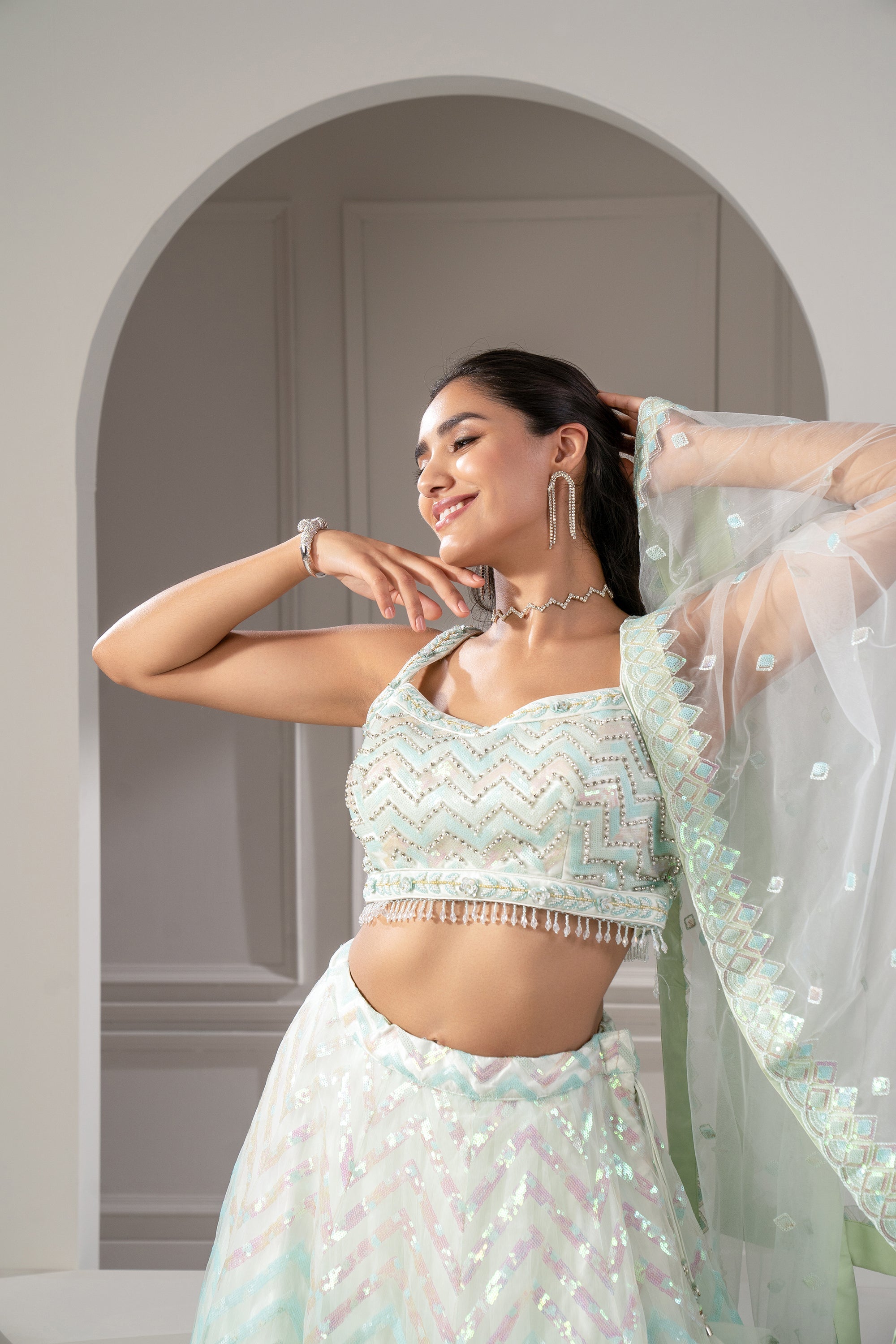 Pista Green Organaza Net Lehenga Set with sequins and stone embellishments.