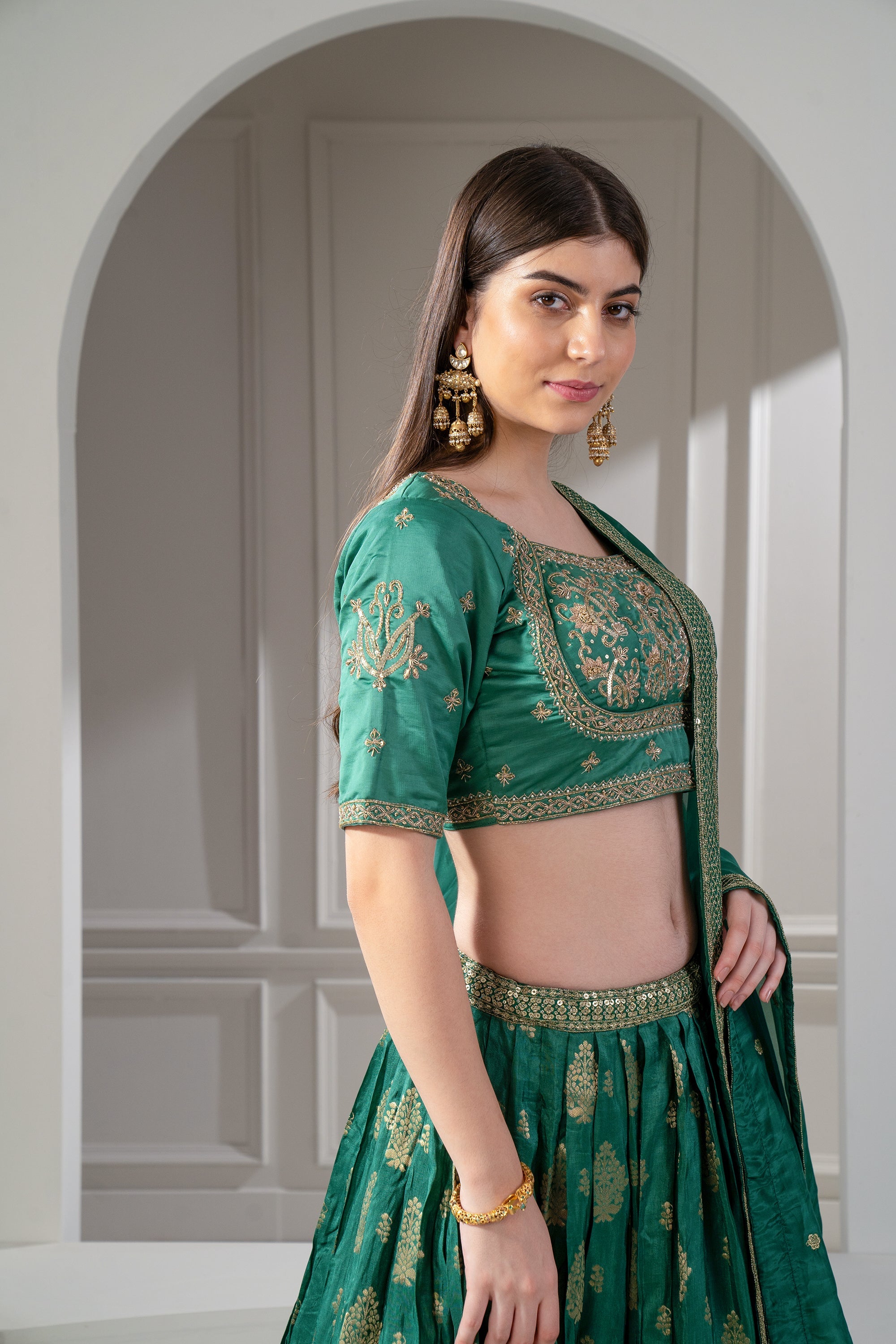 Emerald Green Soft Silk Sequins and Zari Embroidered Lehenga Set.