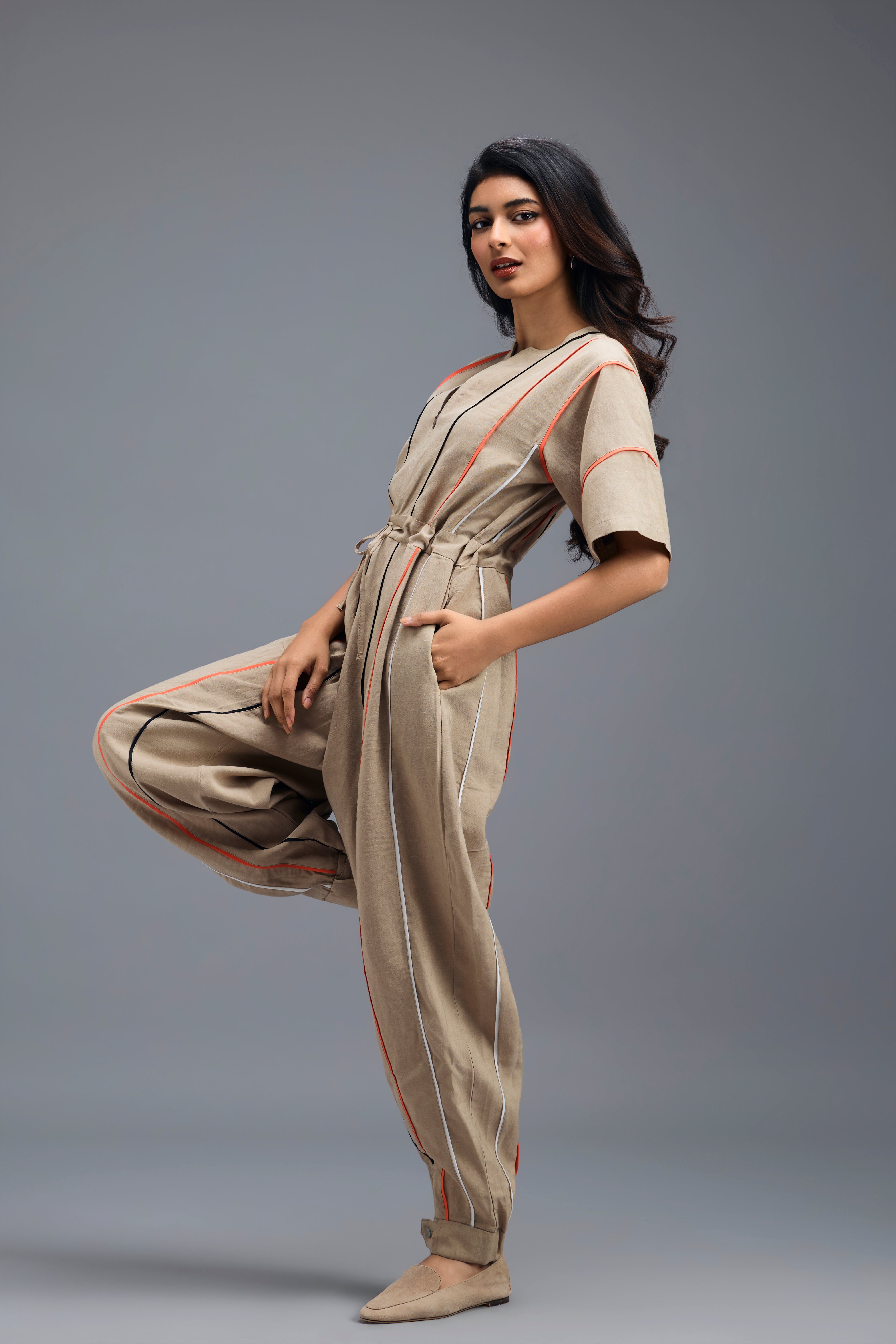 BEIGE ZIP-FRONT JUMPSUIT WITH NEON CONTRAST PIPING