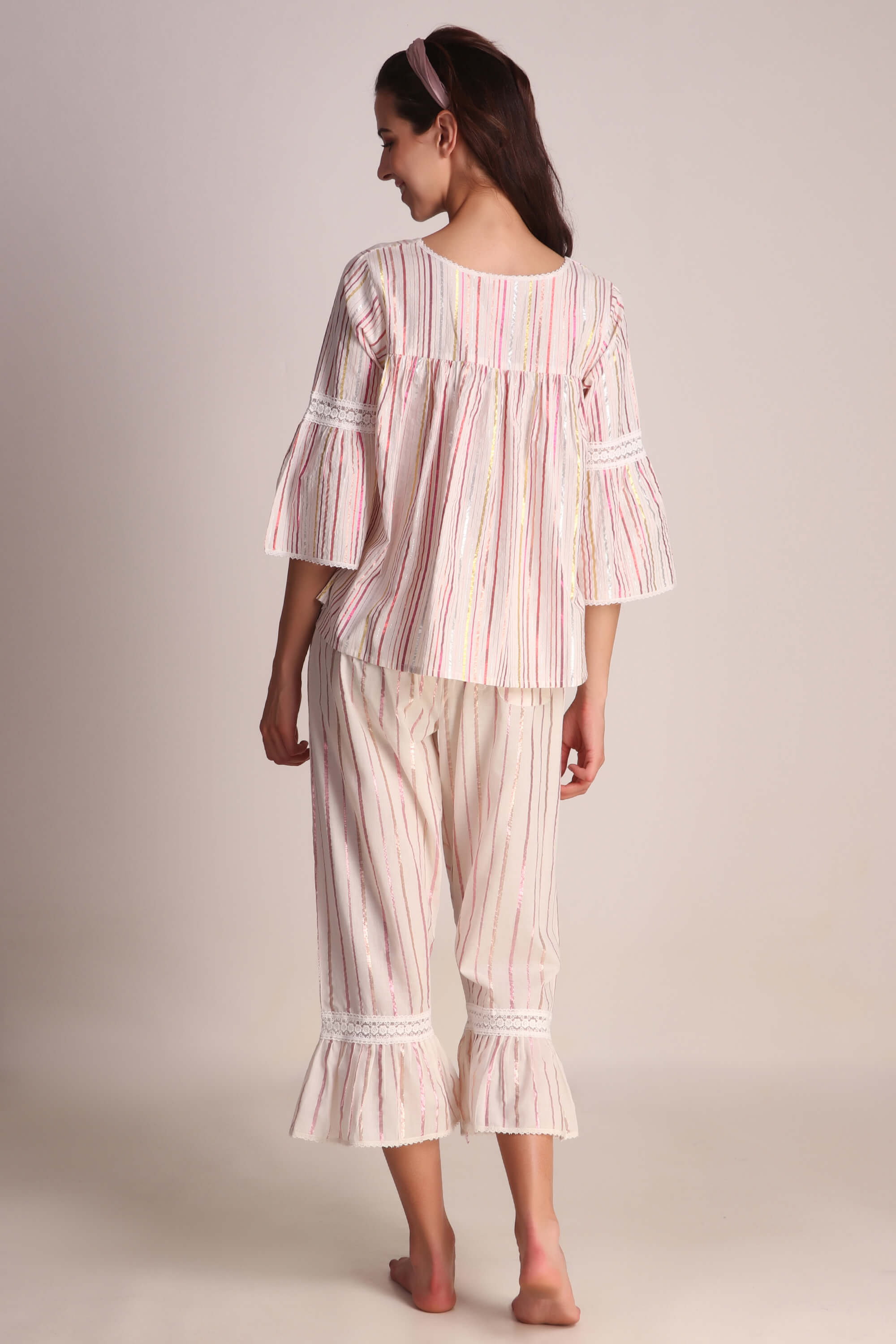 Stylish Opal pyjama suit with striped design and flared sleeves.