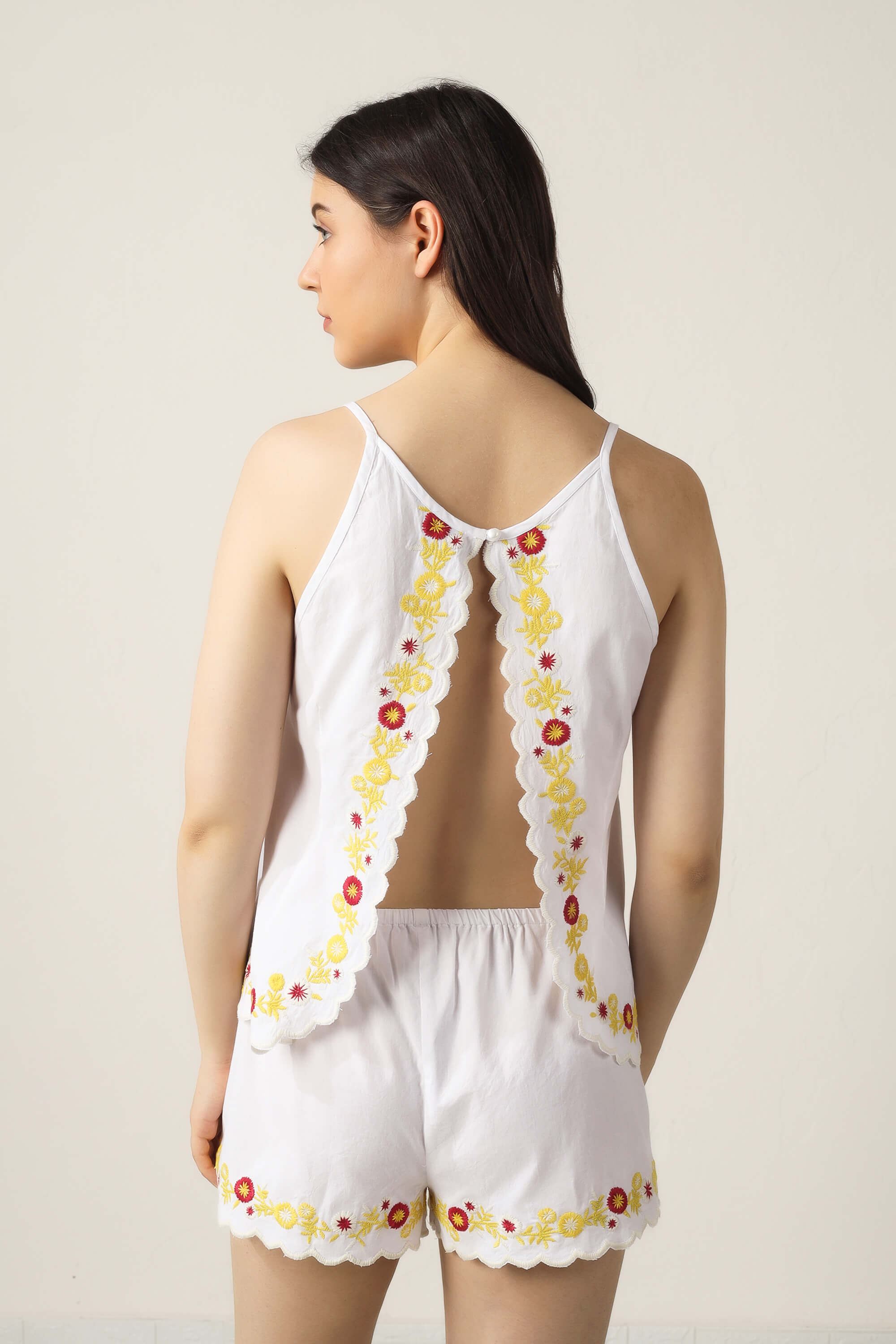 Gwen shorts and camisole set with floral embroidery detail.