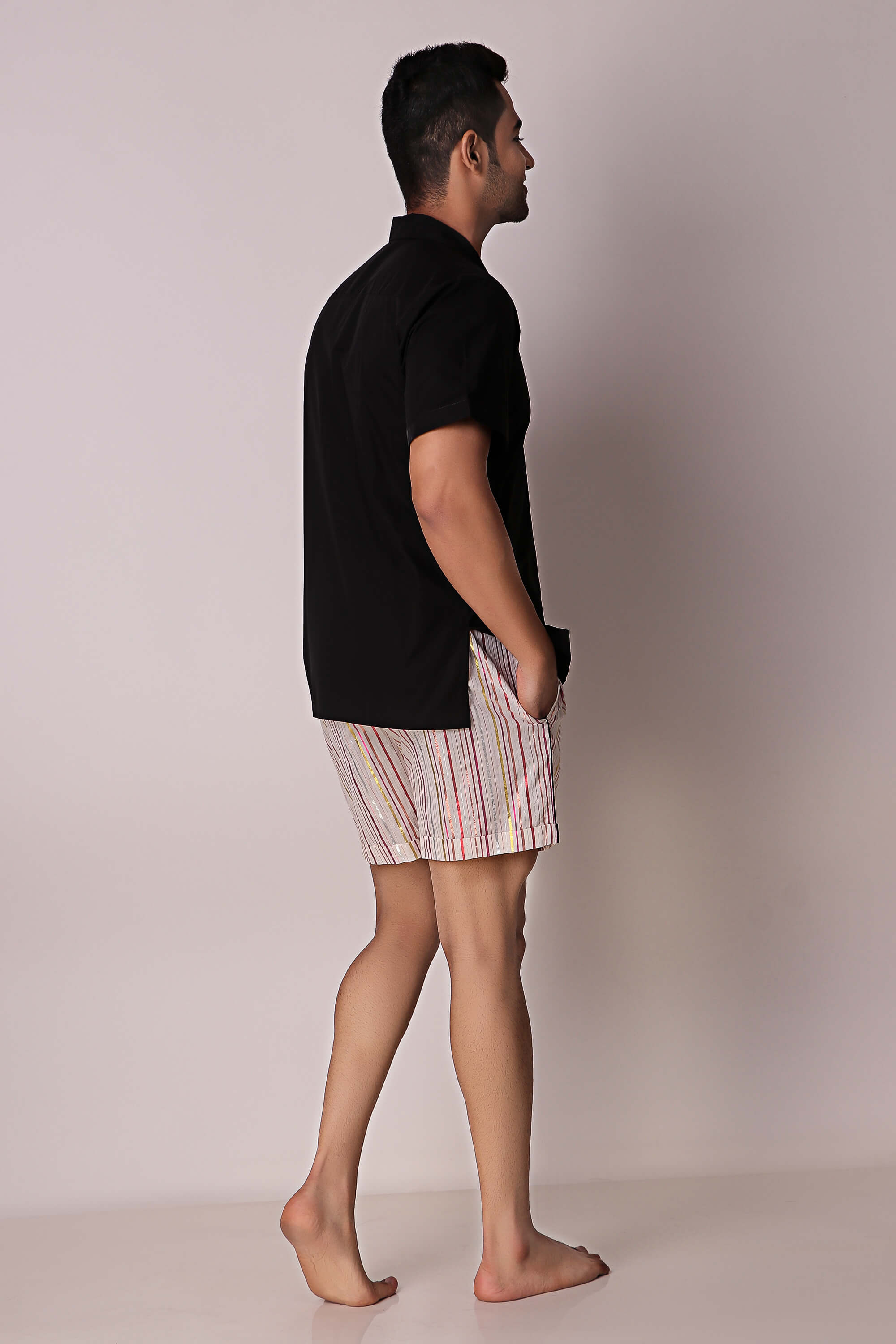 Men's shorts set featuring a black shirt and striped shorts.