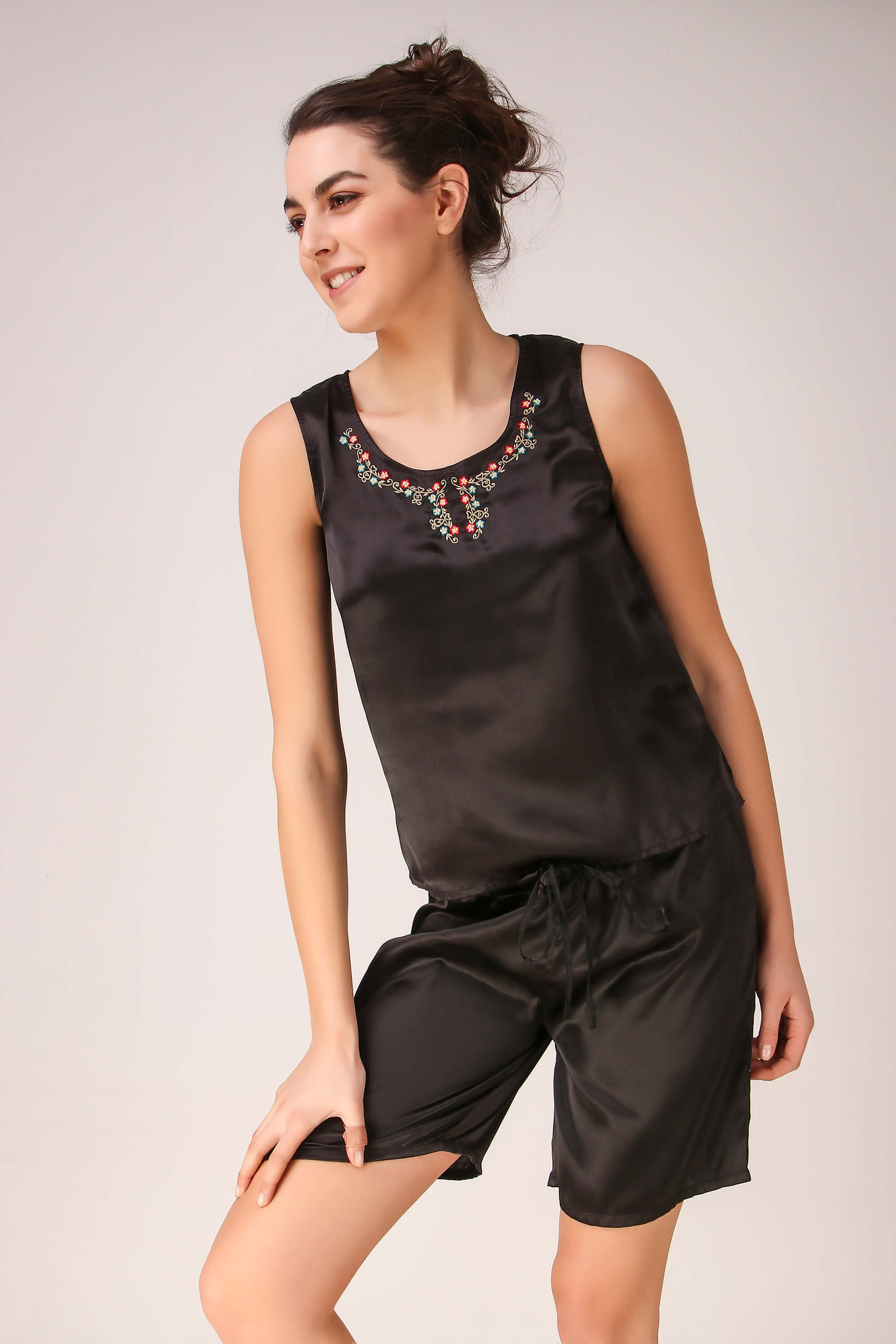 Elegant black shorts set with embroidered detailing for women.