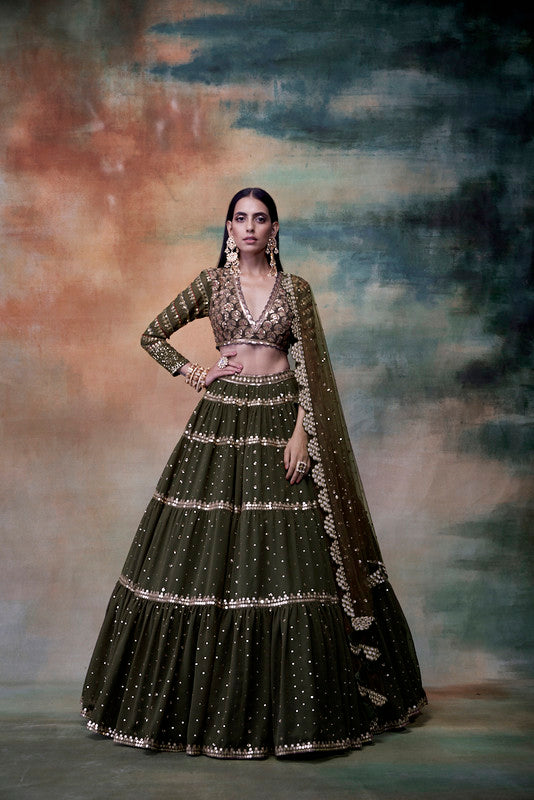 Image of Olive green tier lehenga set