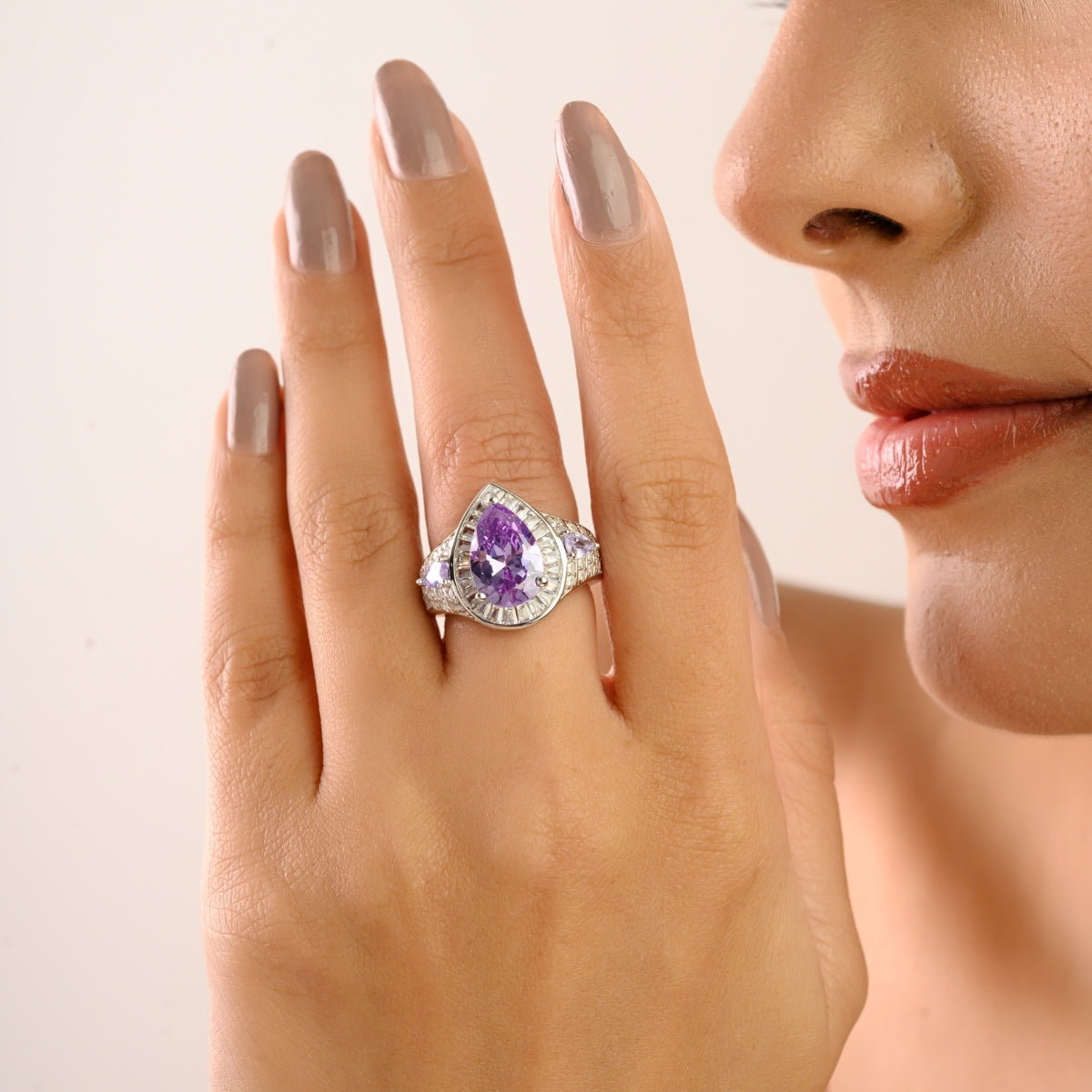 Opulent Silver Ring with Bold Pear Amethyst and CZ Baguettes
