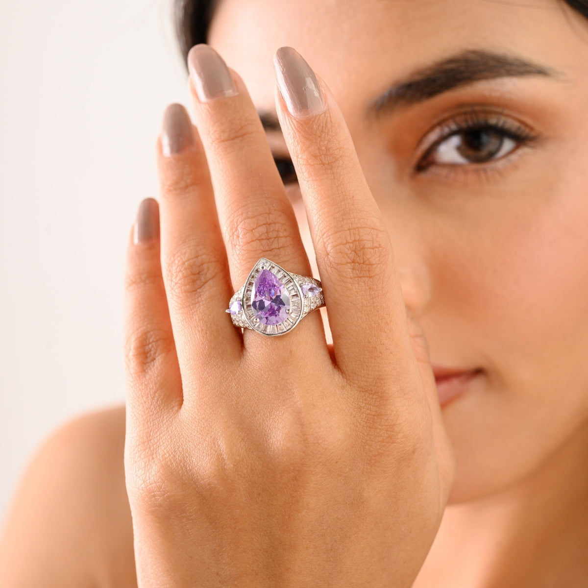 Opulent Silver Ring with Bold Pear Amethyst and CZ Baguettes