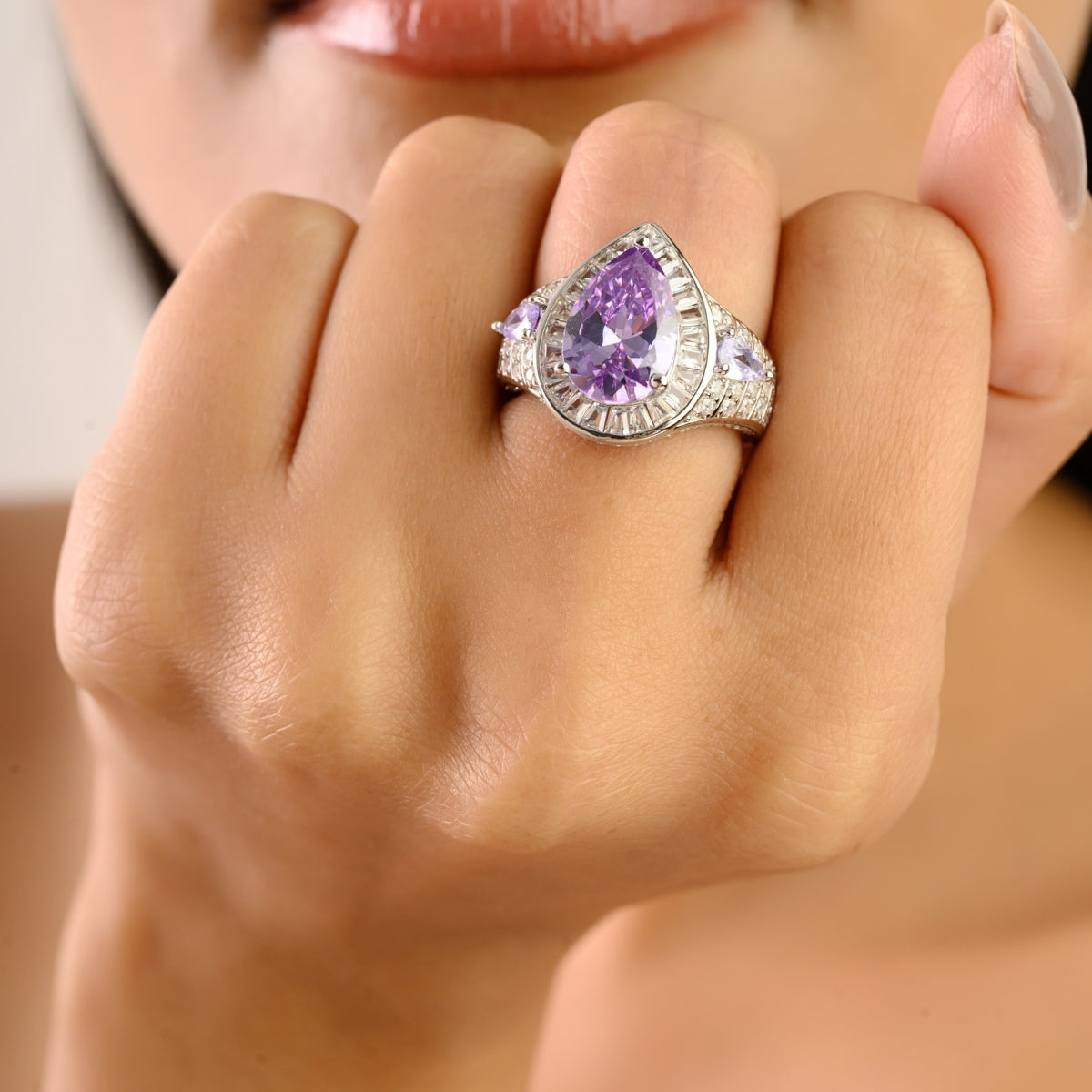 Opulent Silver Ring with Bold Pear Amethyst and CZ Baguettes