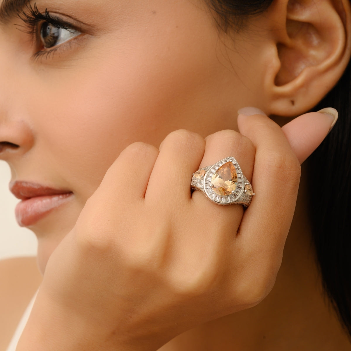 Opulent Silver Ring with Bold Pear Citrine and CZ Baguettes