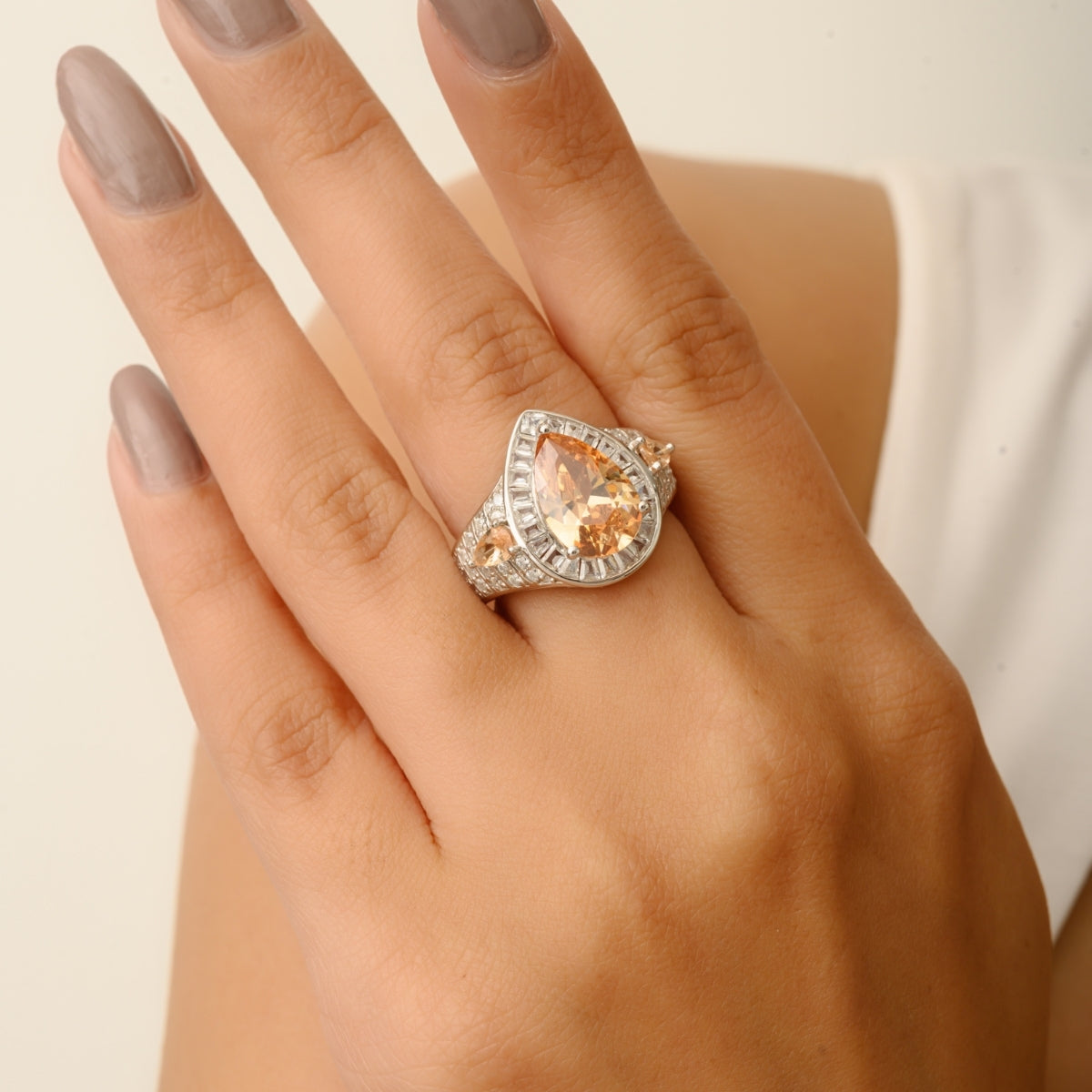 Opulent Silver Ring with Bold Pear Citrine and CZ Baguettes