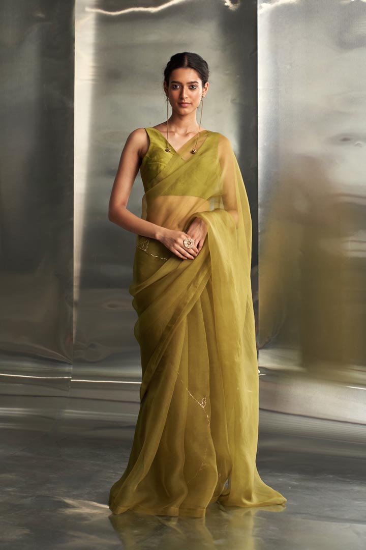 Image of Berry Green saree with sleeveless blouse