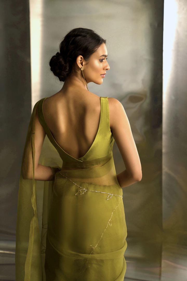 Image of Berry Green saree with sleeveless blouse