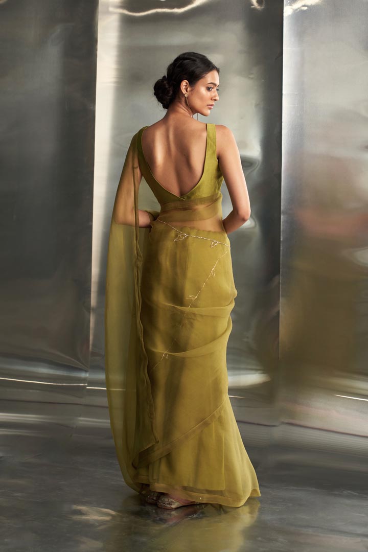 Image of Berry Green saree with sleeveless blouse