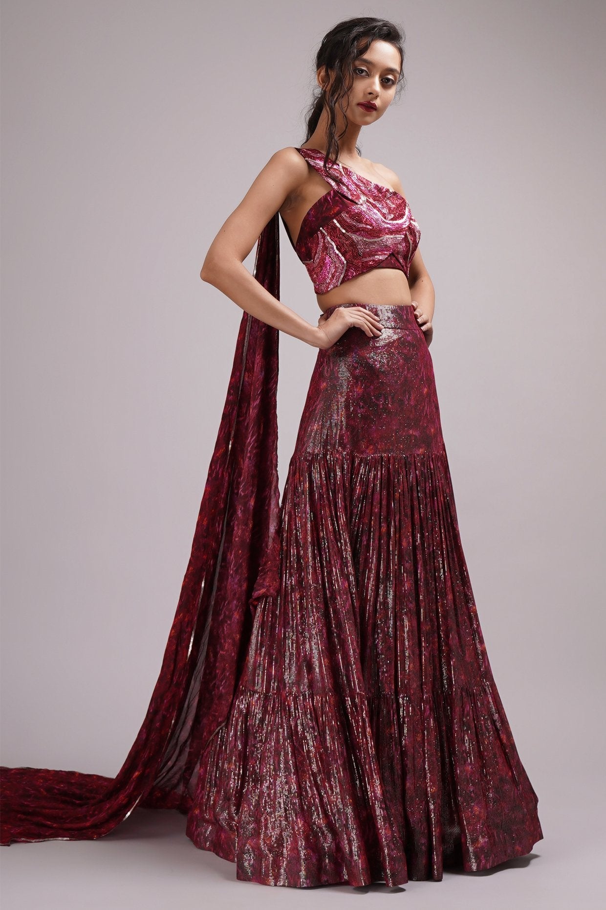 Heavily Embelished Gown Style One Shoulder Blouse Lehenga Set.