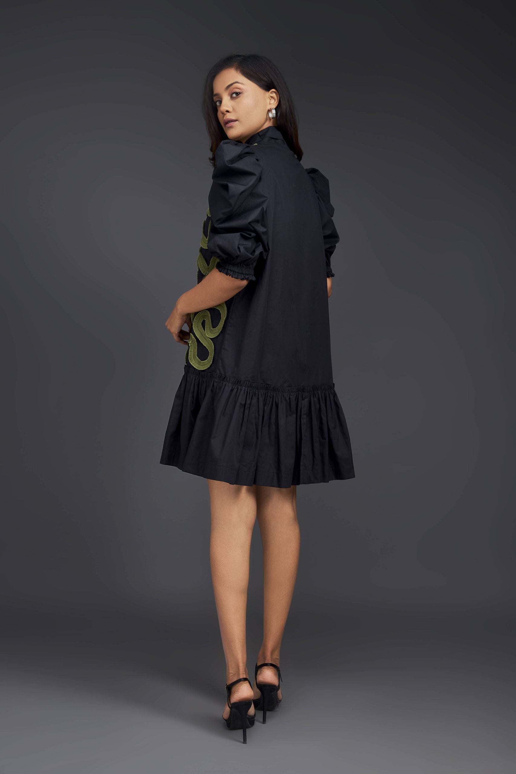 BLACK DRESS WITH GATHERED BOTTOM & PLEATED FRILL DETAILING ALL OVER FRONT.