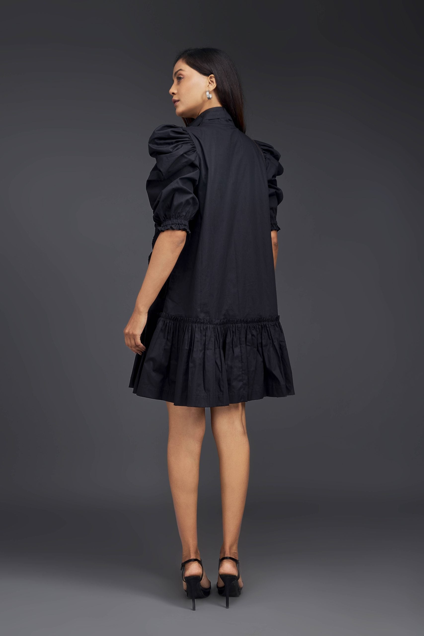 BLACK DRESS WITH GATHERED BOTTOM & PLEATED FRILL DETAILING ALL OVER FRONT.