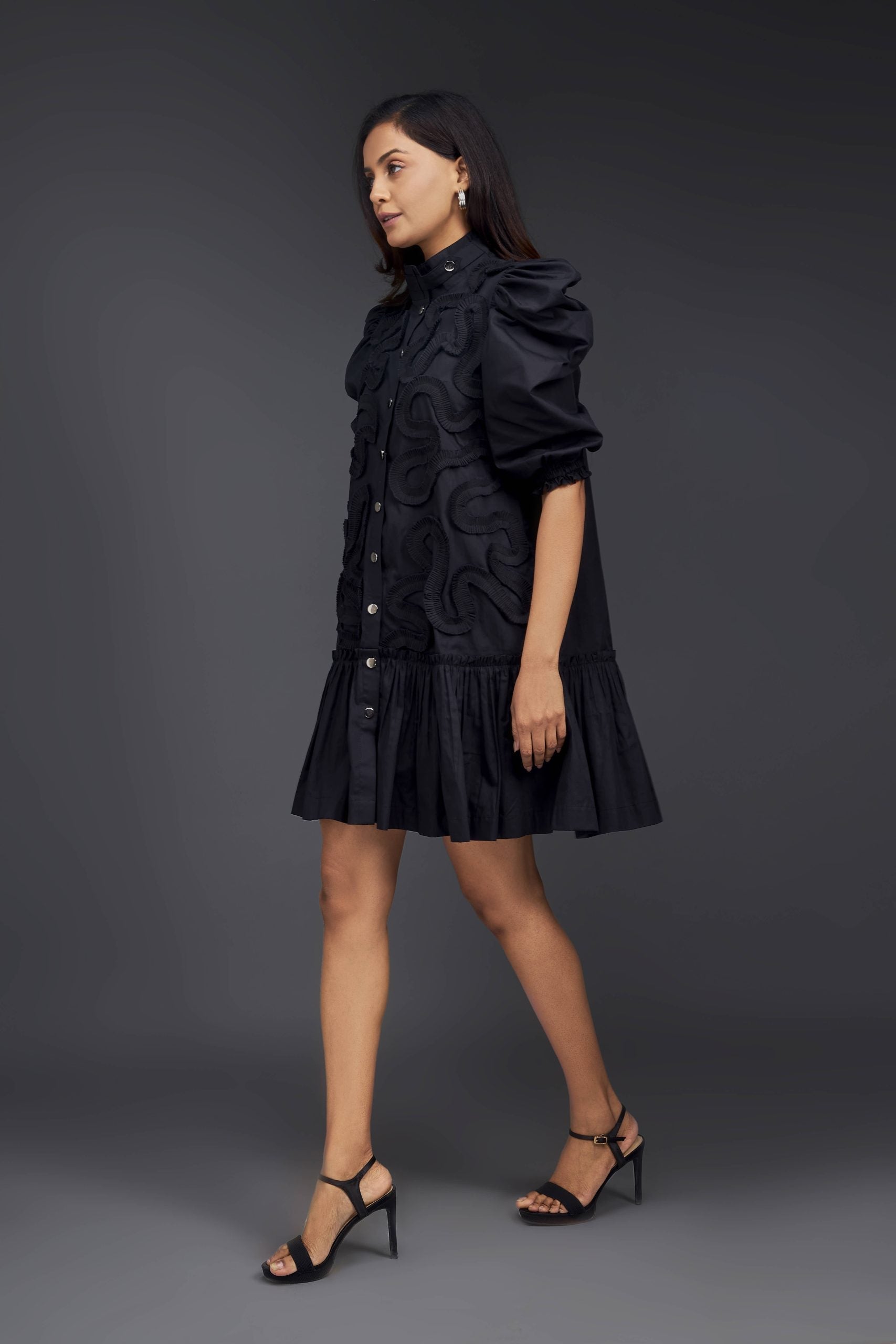 BLACK DRESS WITH GATHERED BOTTOM & PLEATED FRILL DETAILING ALL OVER FRONT.