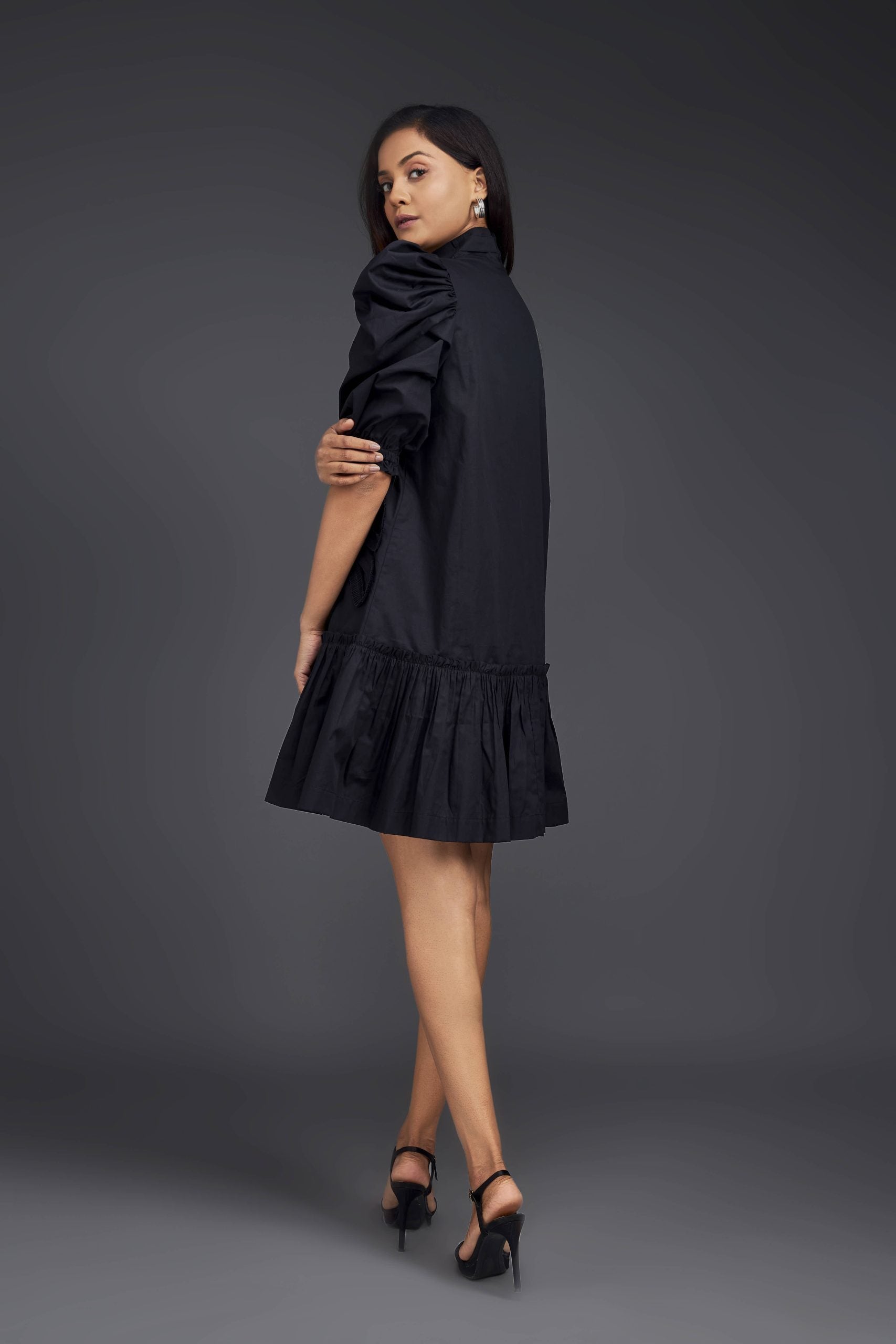 BLACK DRESS WITH GATHERED BOTTOM & PLEATED FRILL DETAILING ALL OVER FRONT.