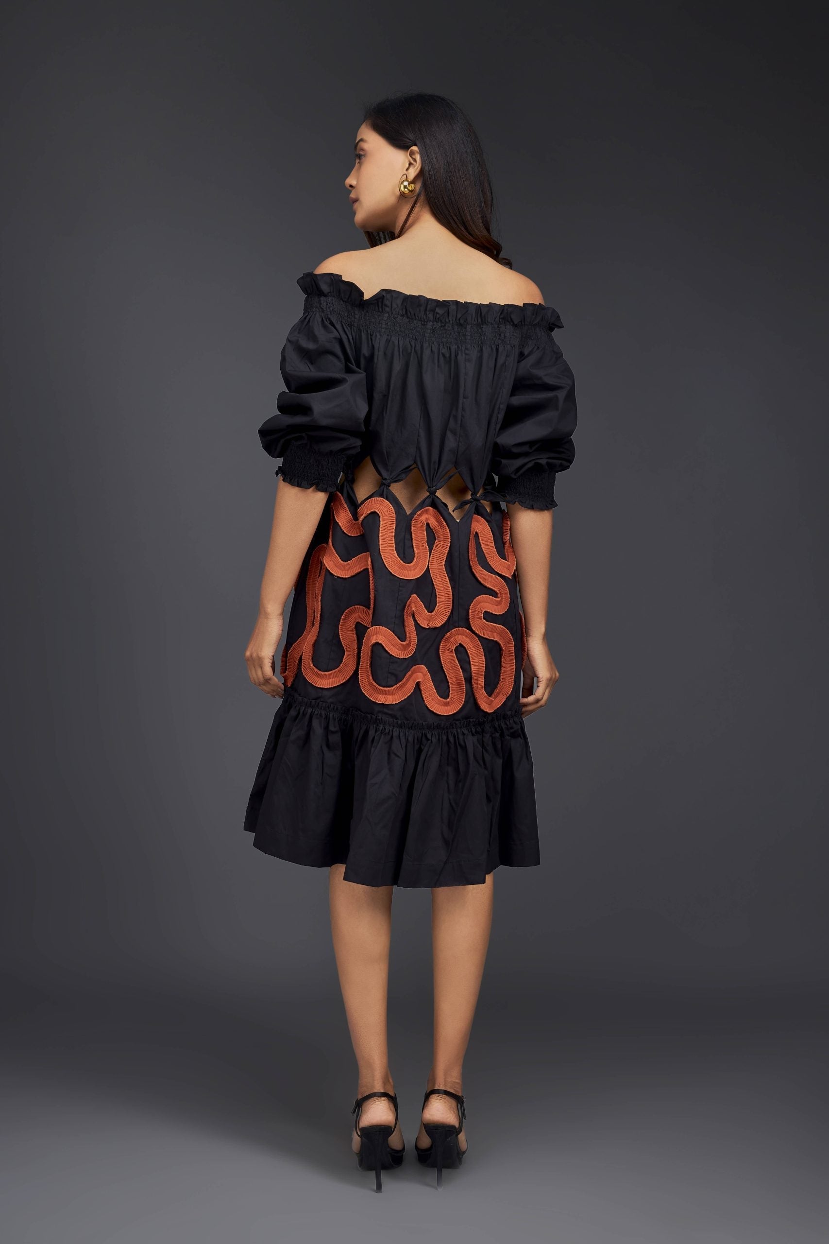 BLACK OFF-SHOULDER DRESS WITH WAIST CUTOUTS AND PLEATED FRILL DETAILING