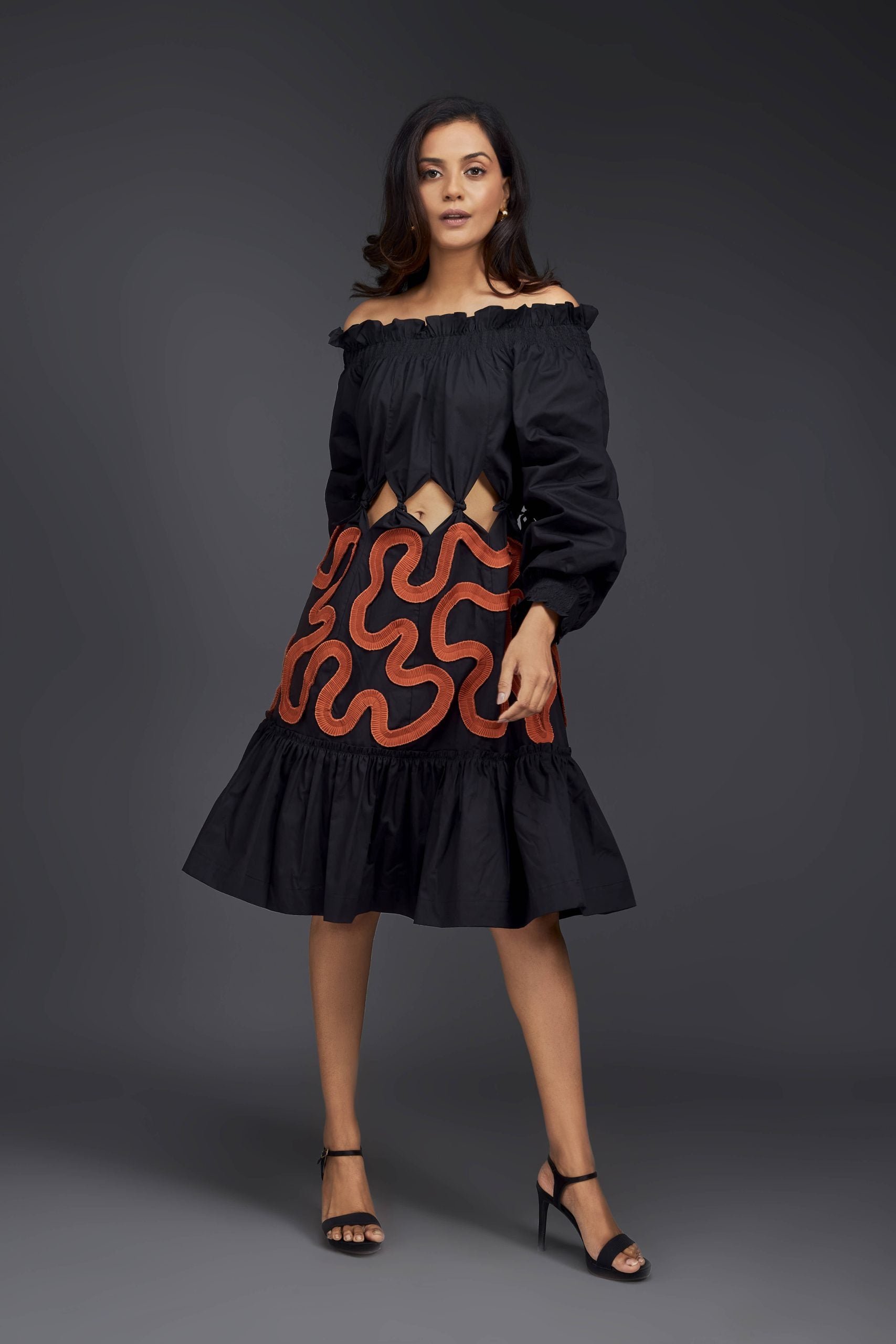BLACK OFF-SHOULDER DRESS WITH WAIST CUTOUTS AND PLEATED FRILL DETAILING