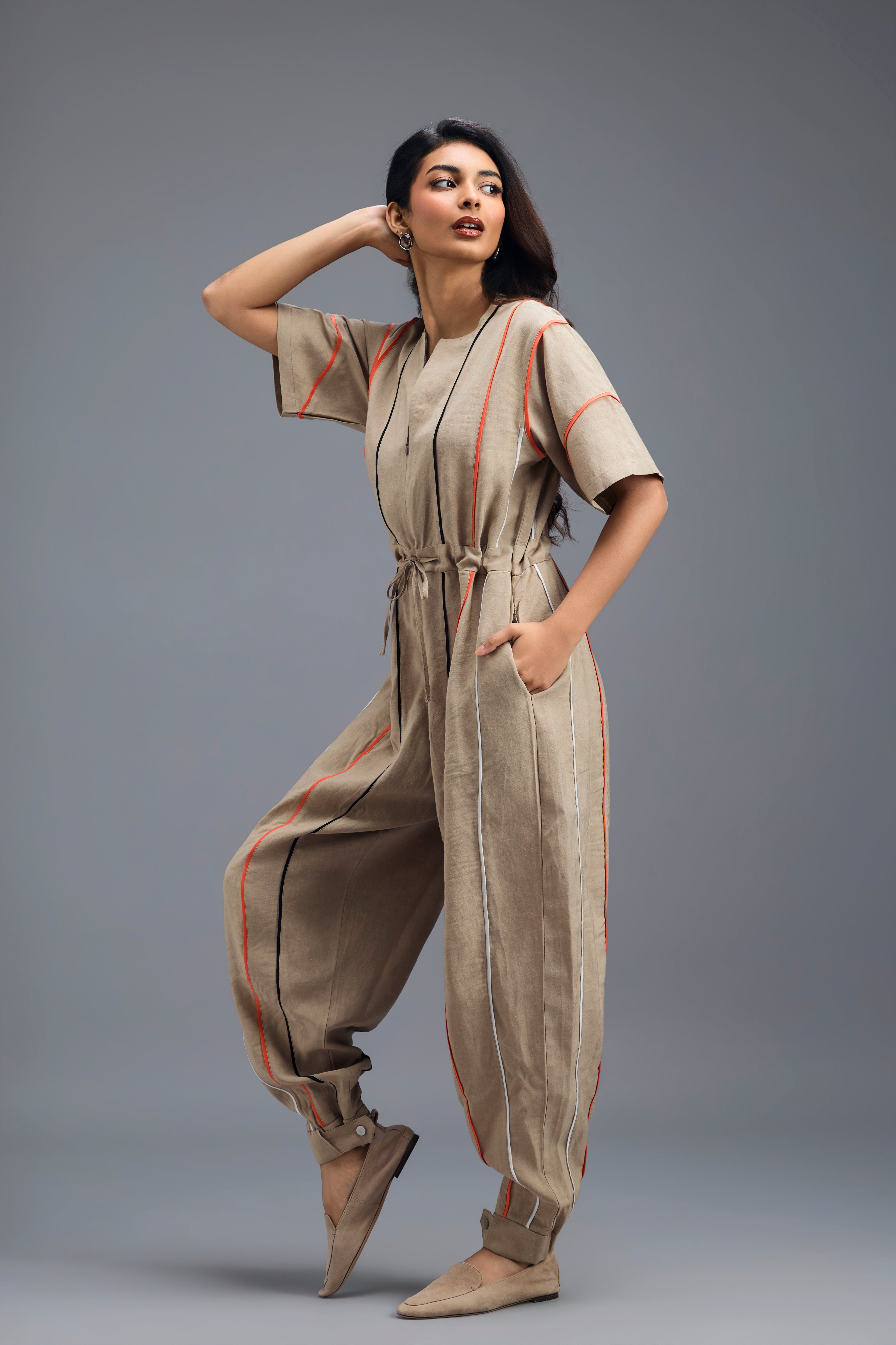 BEIGE ZIP-FRONT JUMPSUIT WITH NEON CONTRAST PIPING