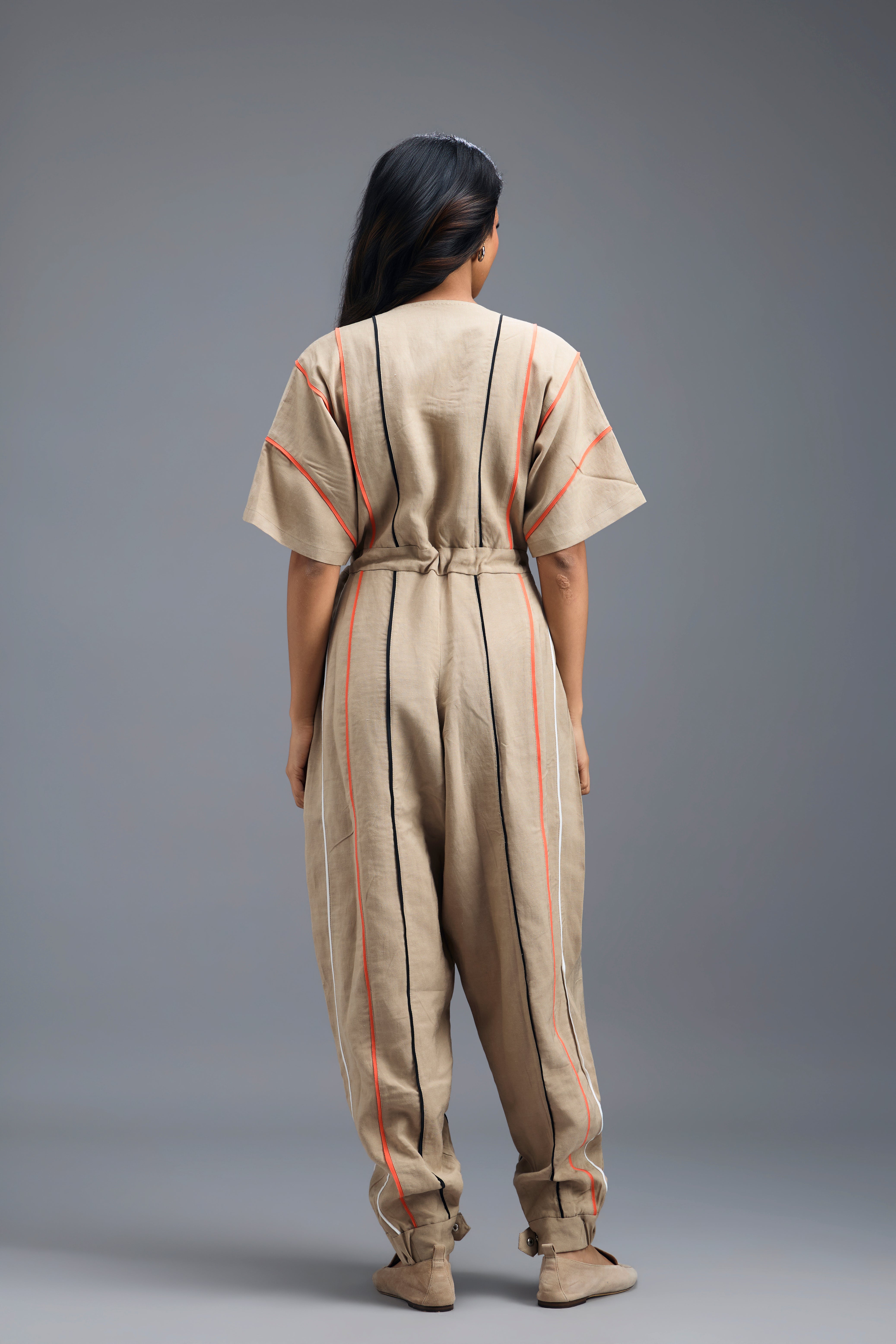 BEIGE ZIP-FRONT JUMPSUIT WITH NEON CONTRAST PIPING