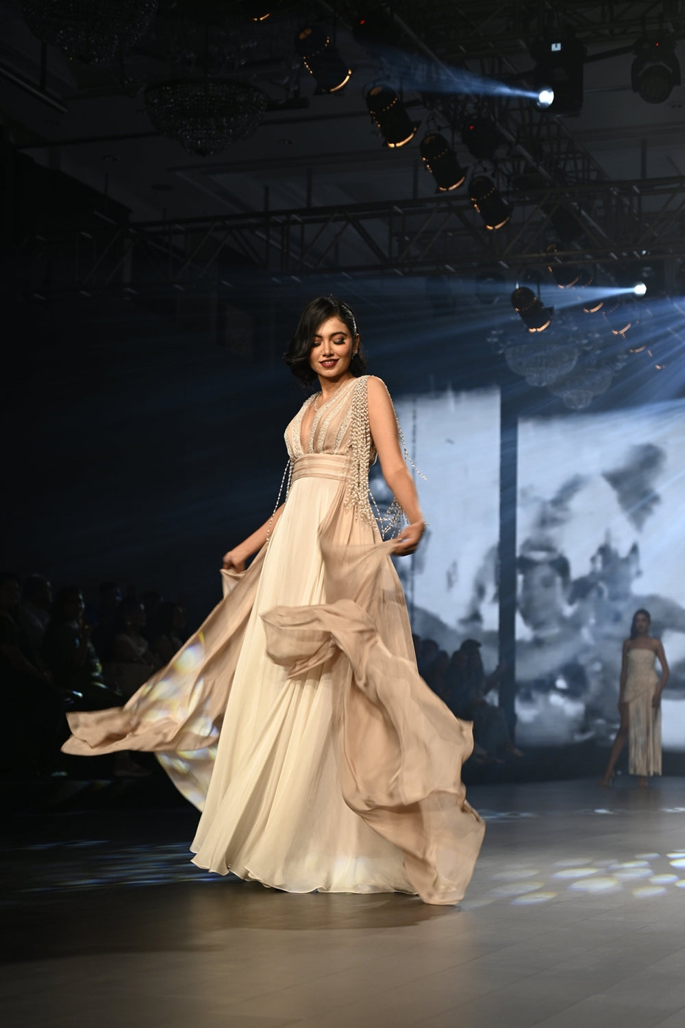 Ivory and taupe maxi dress with embellished tassels.