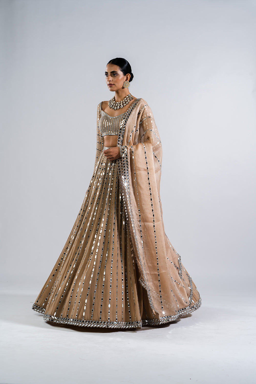 Beige Mirror Seam Lehenga Set.